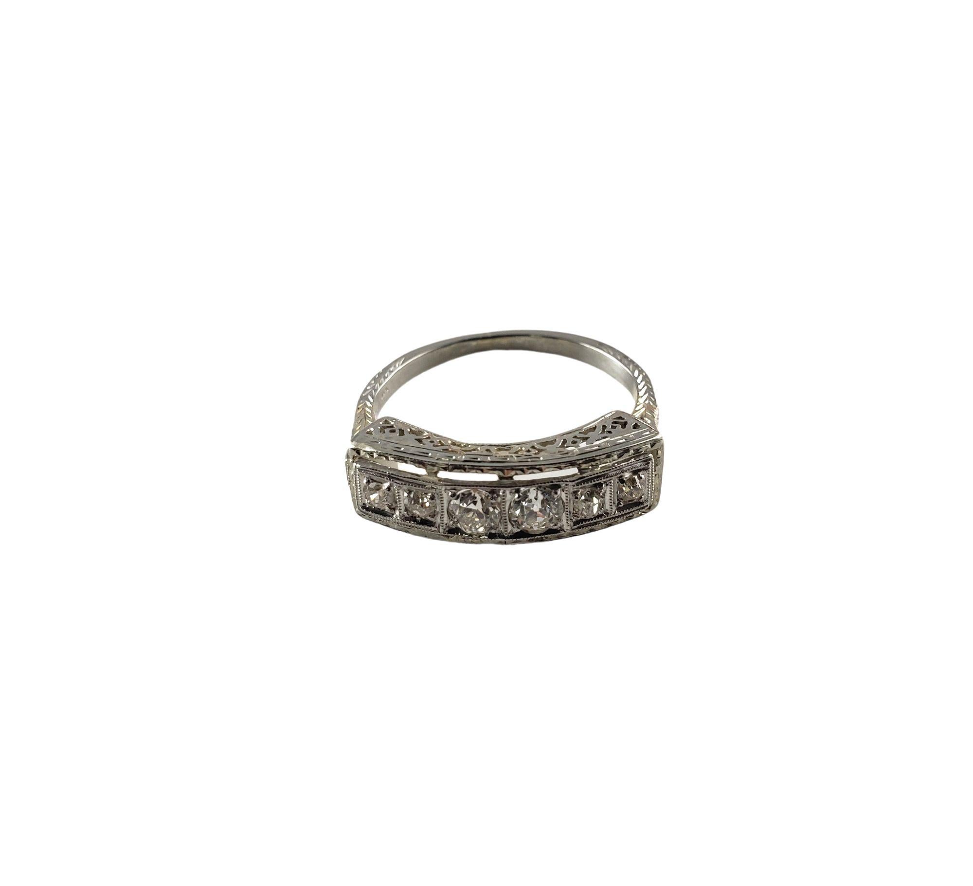 Vintage 10 Karat White Gold Filigree and Diamond Ring Size 6.25-

This sparkling ring features six round old mine cut diamonds* set in beautifully detailed 10K white gold. Width: 6 mm.
Shank: 1.5 mm.
*One stone has chip to table not visible to naked