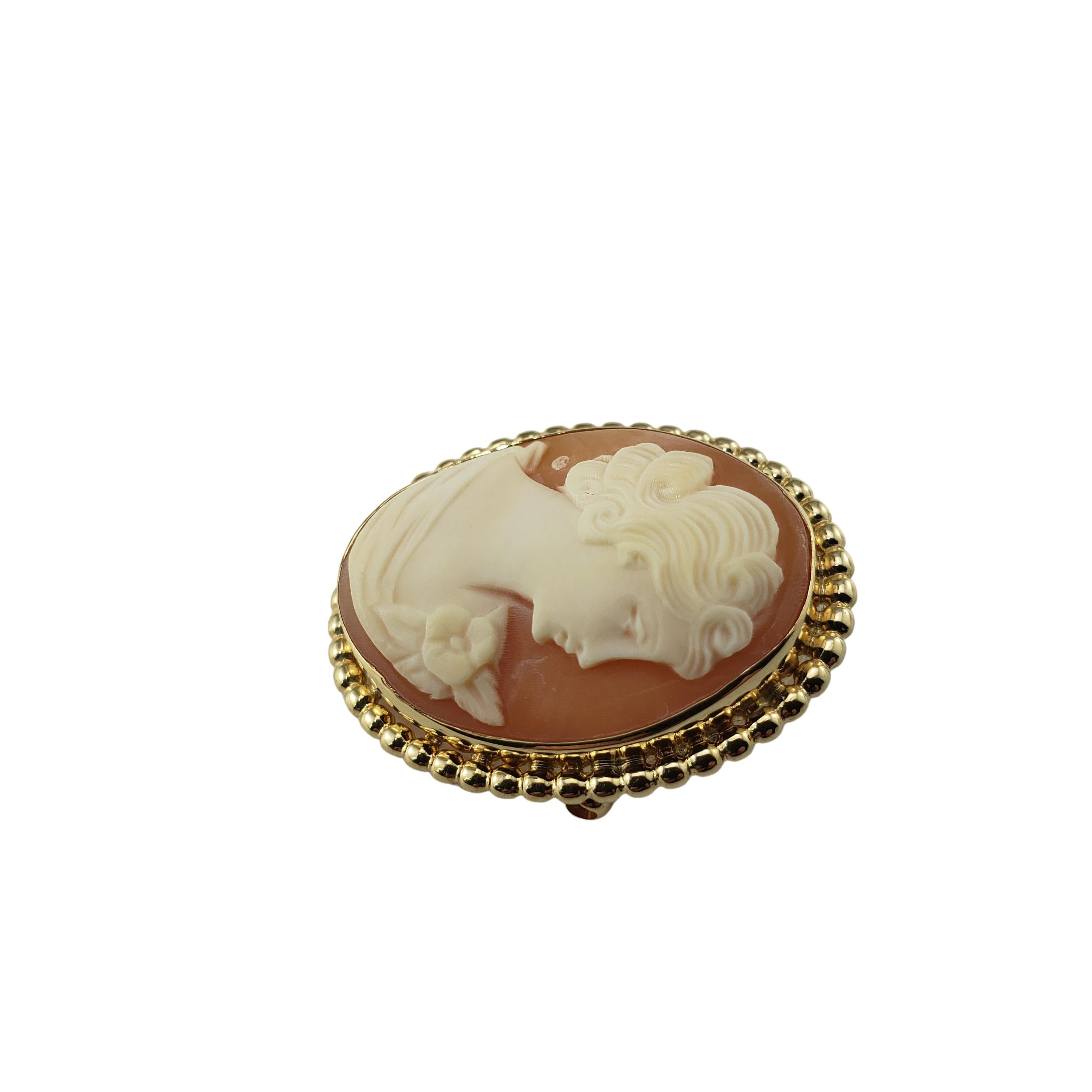 Vintage 10 Karat Yellow Gold Cameo Brooch/Pendant-

This elegant cameo features a lovely lady in profile set in beautifully detailed 10K yellow gold. Can be worn as a brooch or a pendant.

Size: 29 mm x 23 mm

Weight: 3.8 dwt. / 6.0 gr.

Stamped: