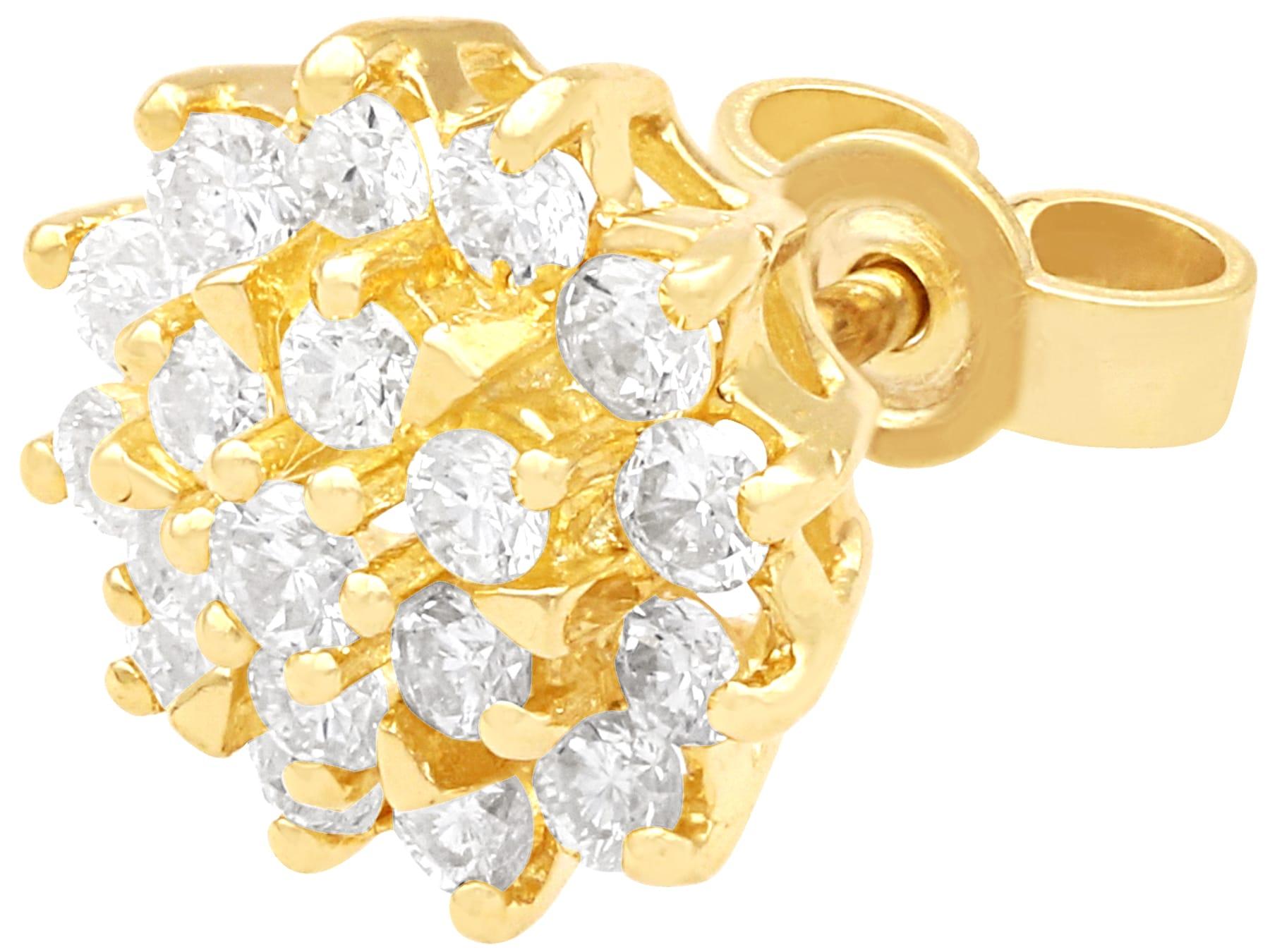 Fino e impresionante par de pendientes vintage de diamantes de 1,00 quilates y racimo de oro amarillo de 14 quilates; forman parte de nuestras colecciones de joyería vintage y joyería de herencia.

Estos impresionantes pendientes de oro y diamantes