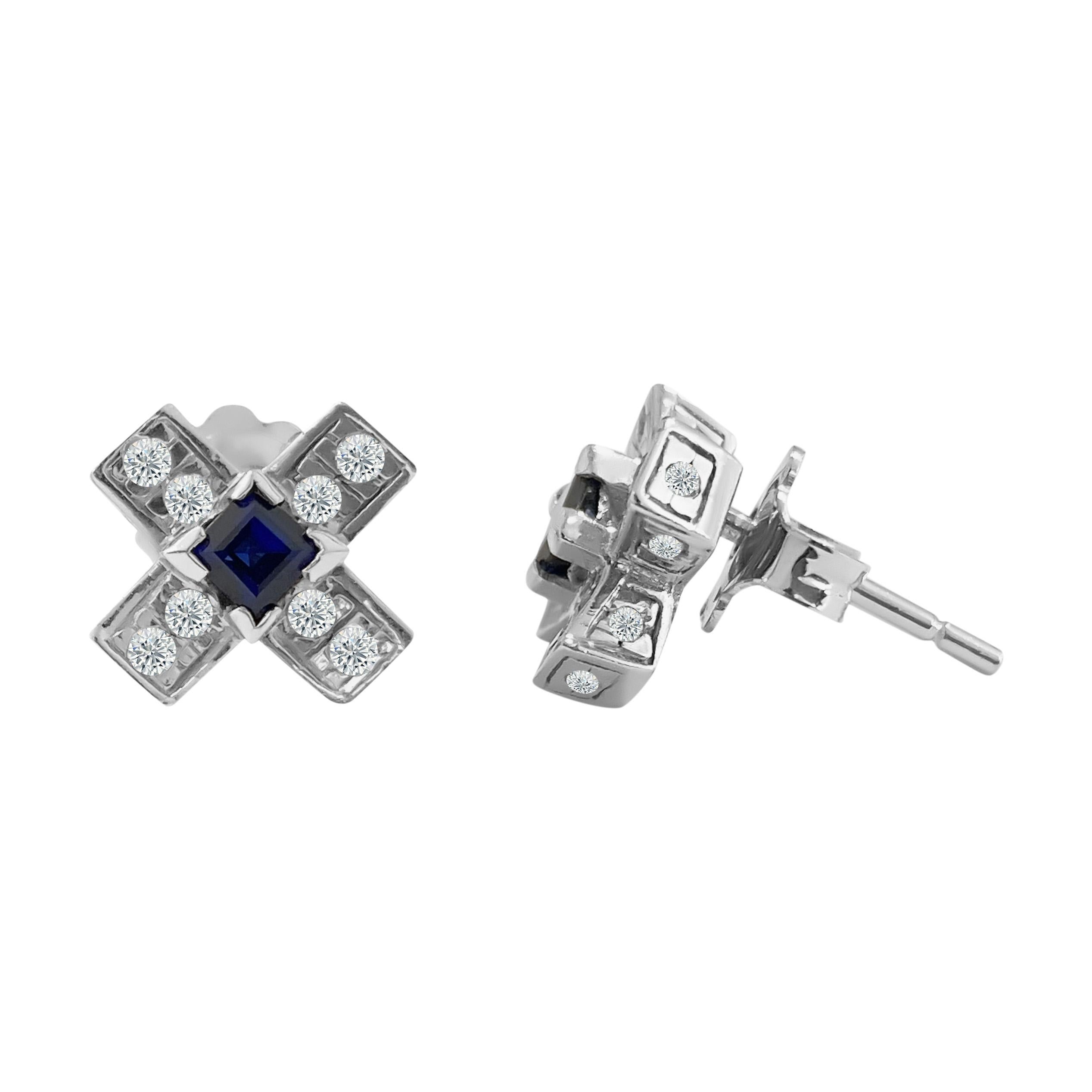 Metal: 14k white gold. 

Diamonds:  0.60 cwt. VS clarity and G color. Round brilliant cut diamonds. 
100% natural earth mined 

Blue sapphire: 0.40 cwt. Princess cut set in prongs. 100% natural earth mined. 

TCW of all stones: 1.00