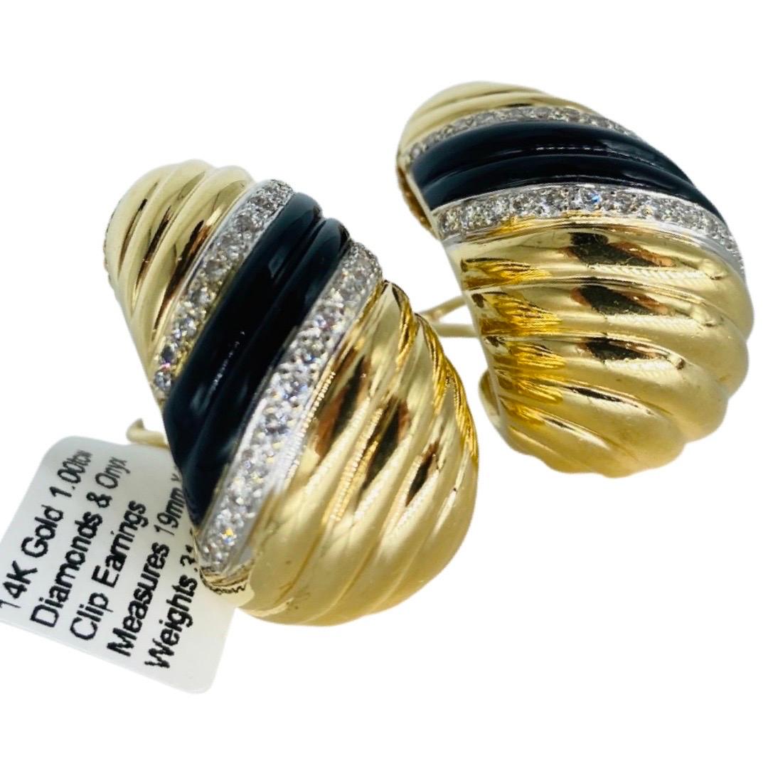 Glamorous Vintage 1.00 Carat Diamonds and Onyx Swirl Omega Back Earrings 14k Gold. The earrings feature round diamonds. The earrings weight 31.2g and measure 19mm X 31mm