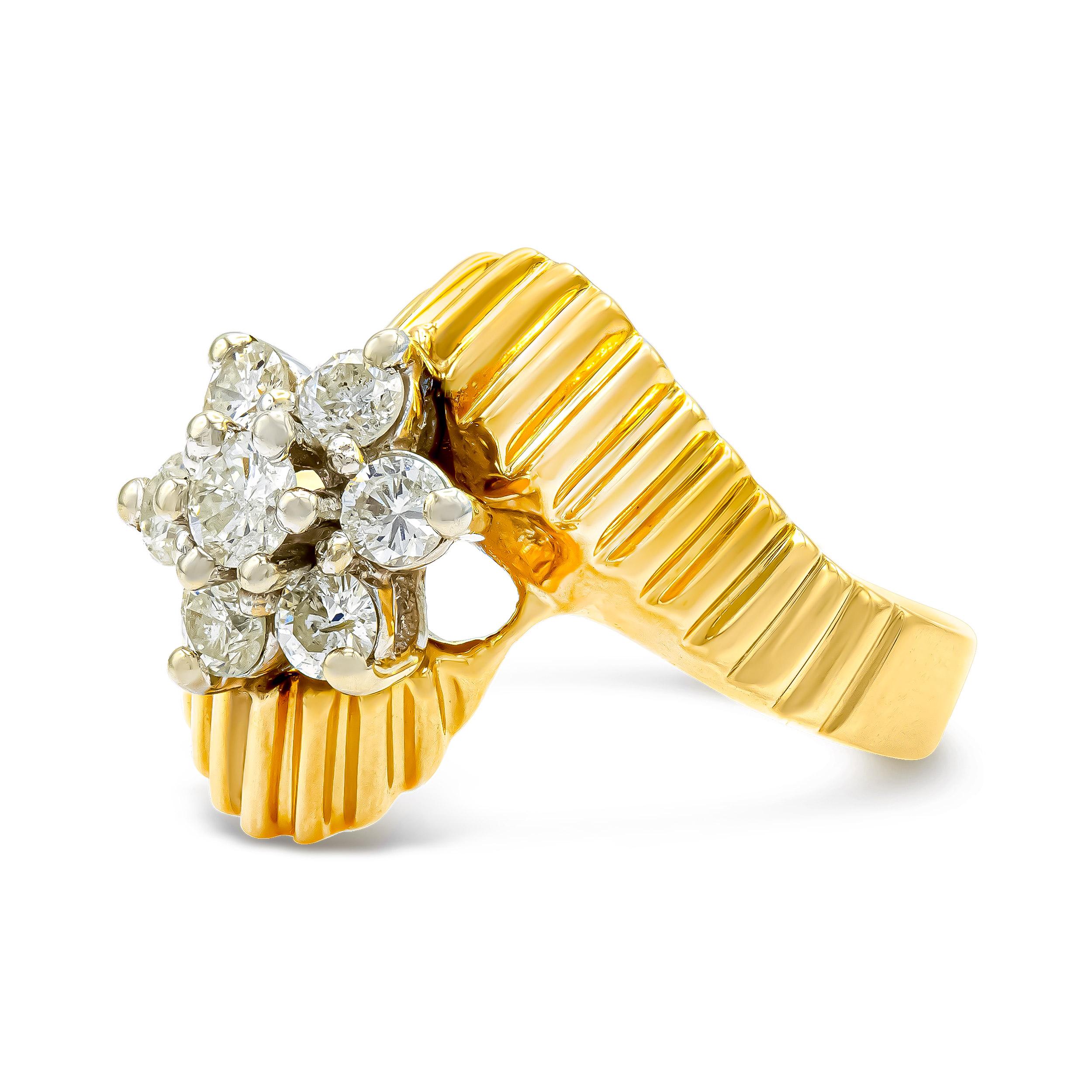 This pleated gold bypass band makes a major statement, paired with a cluster of transitional brilliant-cut diamonds. The floral motif is whimsical, charming, and ideal for daily wear.

Diamond Details:
Accent Stones: (7) Transitional Brilliant Cut