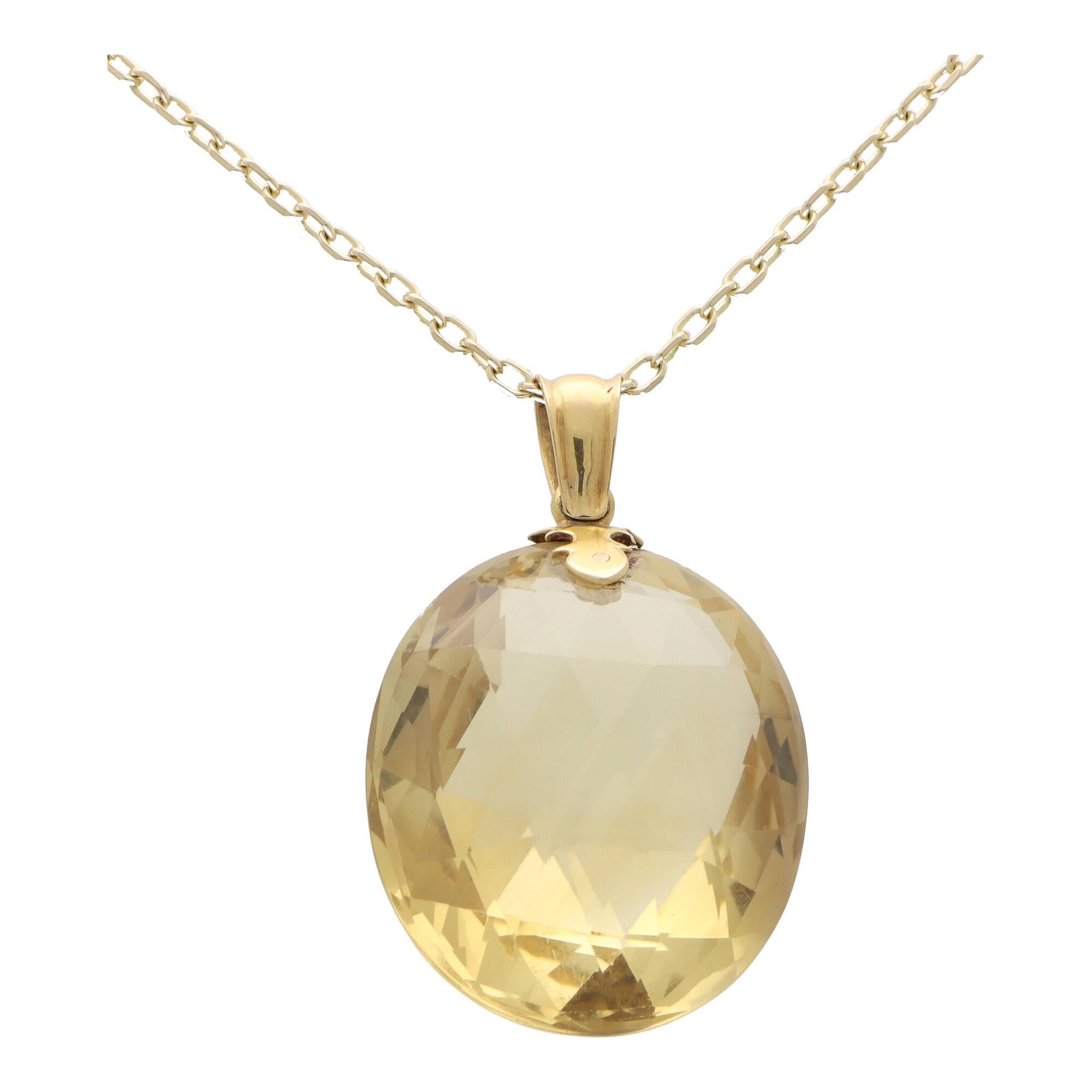 A visually spectacular checkerboard cut citrine pendant set in 9k yellow gold. 

The pendant is solely set with a staggering 100.39 carat oval citrine stone which has been checkerboard cut to both sides. The checkerboard facets project this
