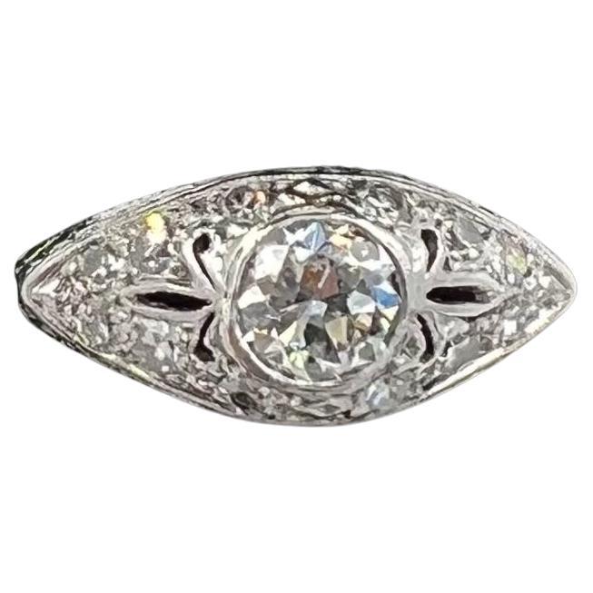 Vintage 1.01 ct tw diamond white gold and platinum engagement ring, circa 1935.

The vintage 1.01 carat total weight white gold and platinum engagement ring is a testament to the changing designs of the late Art Deco era to the beginning of Retro