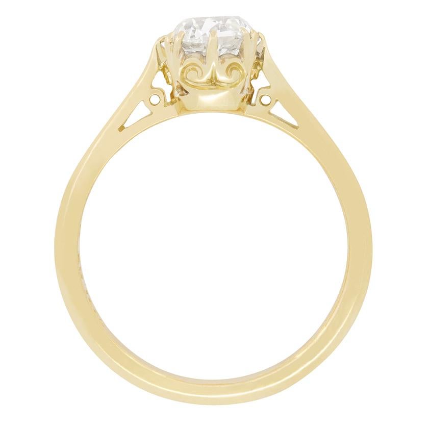 A beautiful old cushion cut diamond sits central in this classic solitaire ring. The 1.01 carat diamond has a colour of H and a clarity of VS2. Claw setting work holds the diamond within a wonderfully decorative collet of 18 carat yellow gold, the