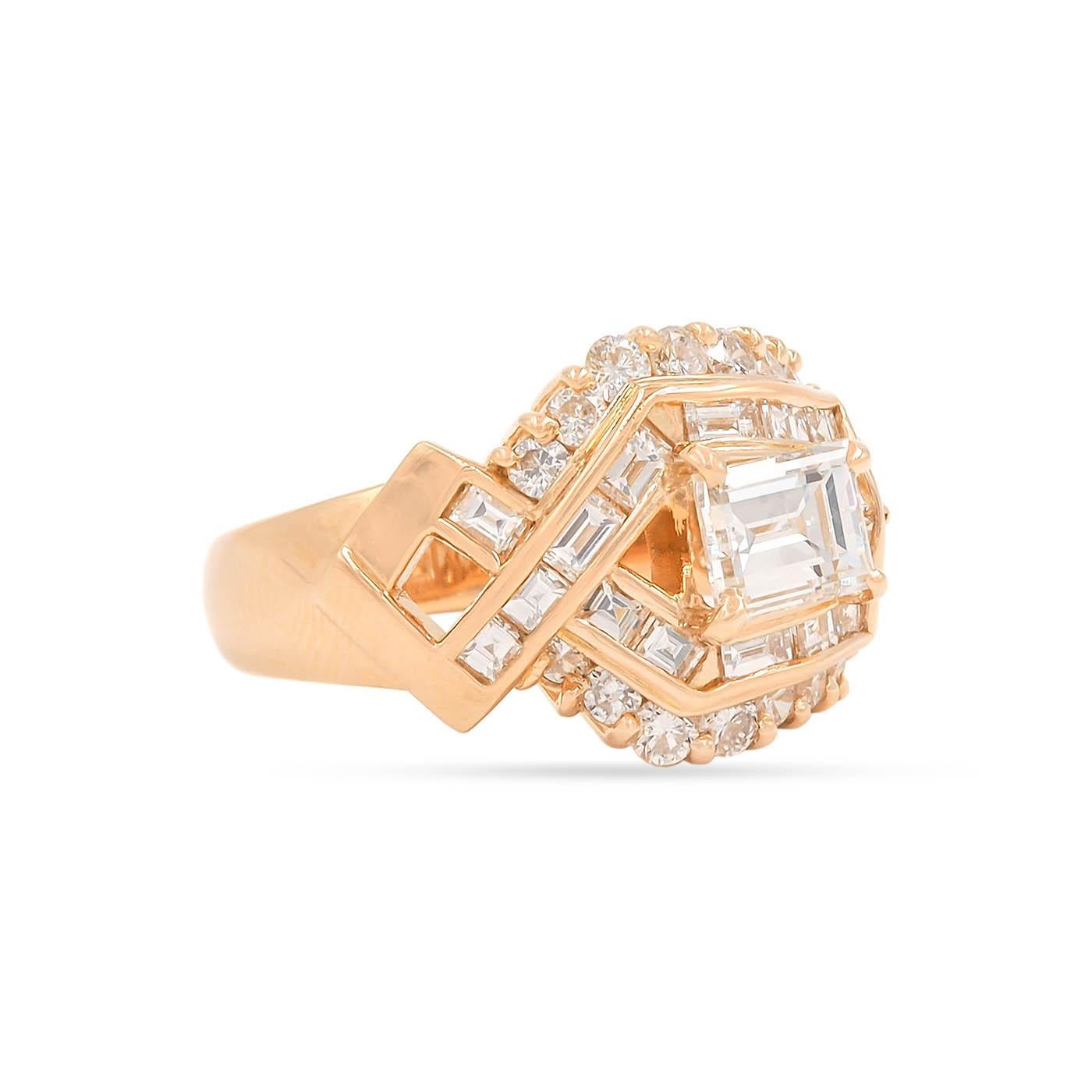 Vintage 1.03 Carat Step Cut Diamond Asymmetrical Cluster Ring composed of 18k yellow gold. With a 1.03 carat Rectangualr Step Cut diamond, GIA certified H color & VS2 clarity. The setting has an asymmetrical styling to it and is further enhanced by