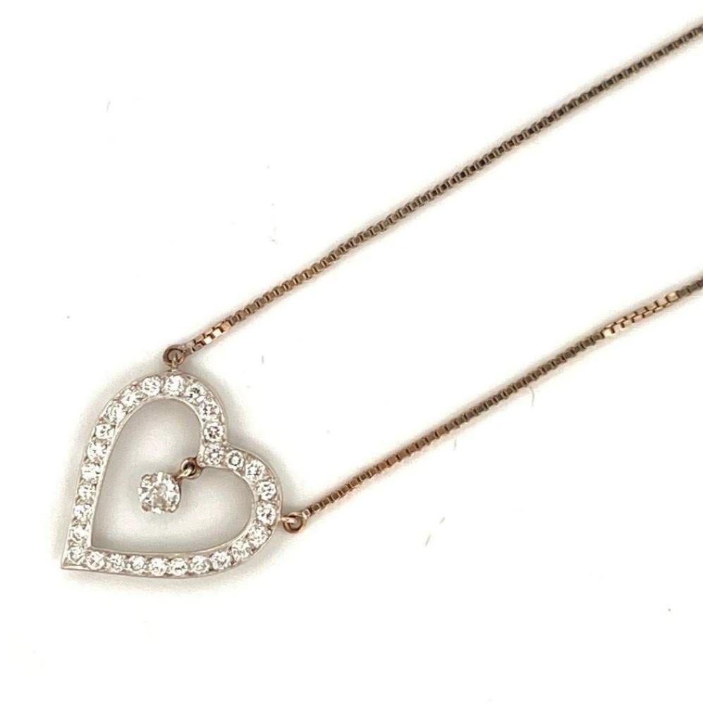 Vintage Natural Diamond Open Heart Pendant Necklace  1.05ctw  18K & 14K White Gold  Old Euro Center

Description:
✦ Offered here is a charming vintage natural diamond open heart dangle necklace. The centerpiece is a .30 carat old European cut
