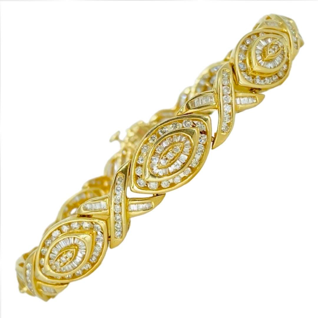 Vintage 9.50 Carat Diamonds XOXO Bracelet 14k Gold. The diamonds in this bracelet are round and baguette cut brilliant diamonds with a total weight of 9.50 carat diamonds weight. The bracelet is 10.5mm in width and is 7.5 inches long. The bracelet