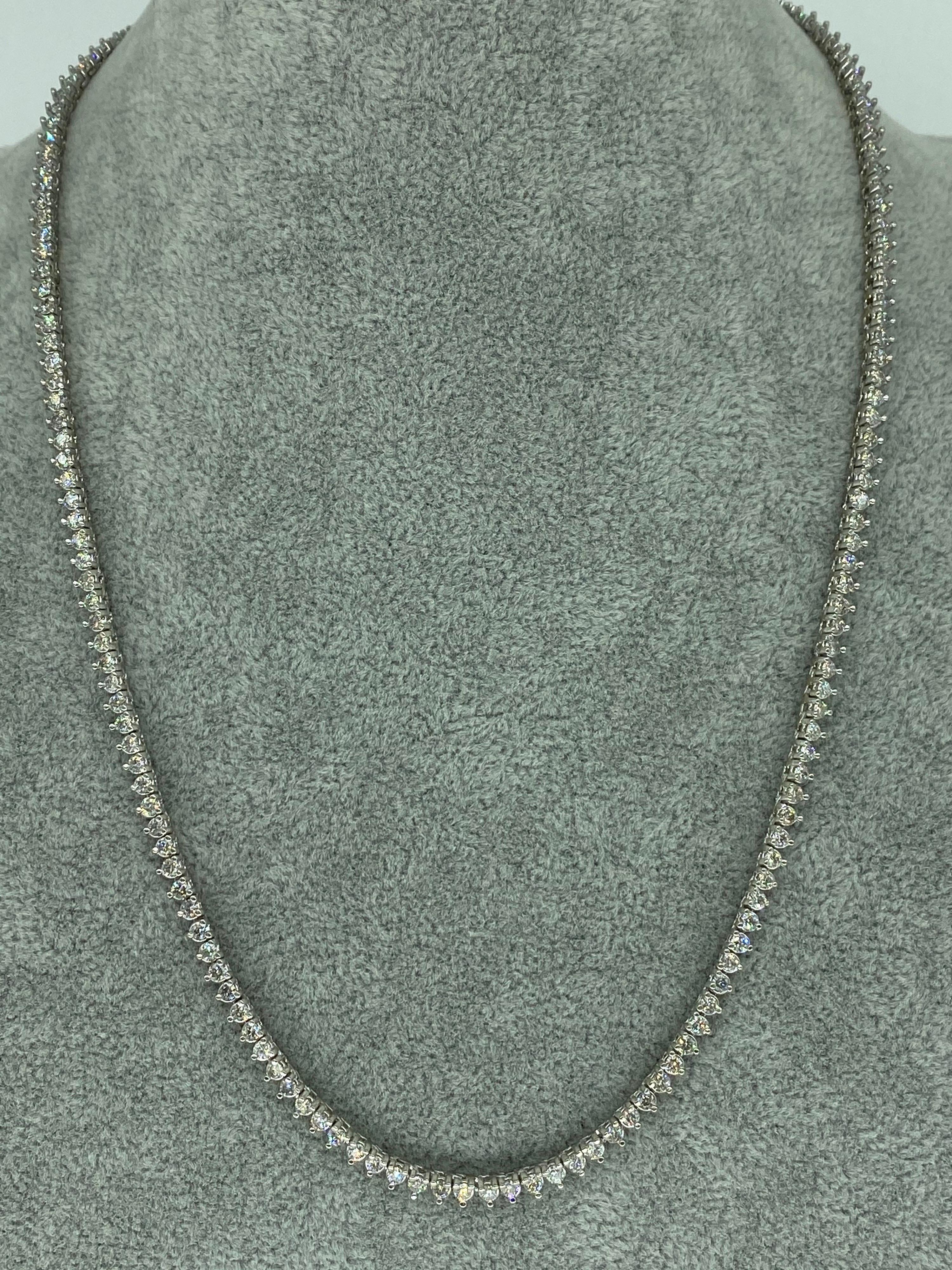 Vintage 10.80 Carat Diamond Martini Tennis Necklace. The Diamonds features are natural SI1/SI2 round in a martini setting. Beautiful white diamonds dancing in the light. Each diamond is approx 0.06ct with approx 180 total diamonds. The necklace is