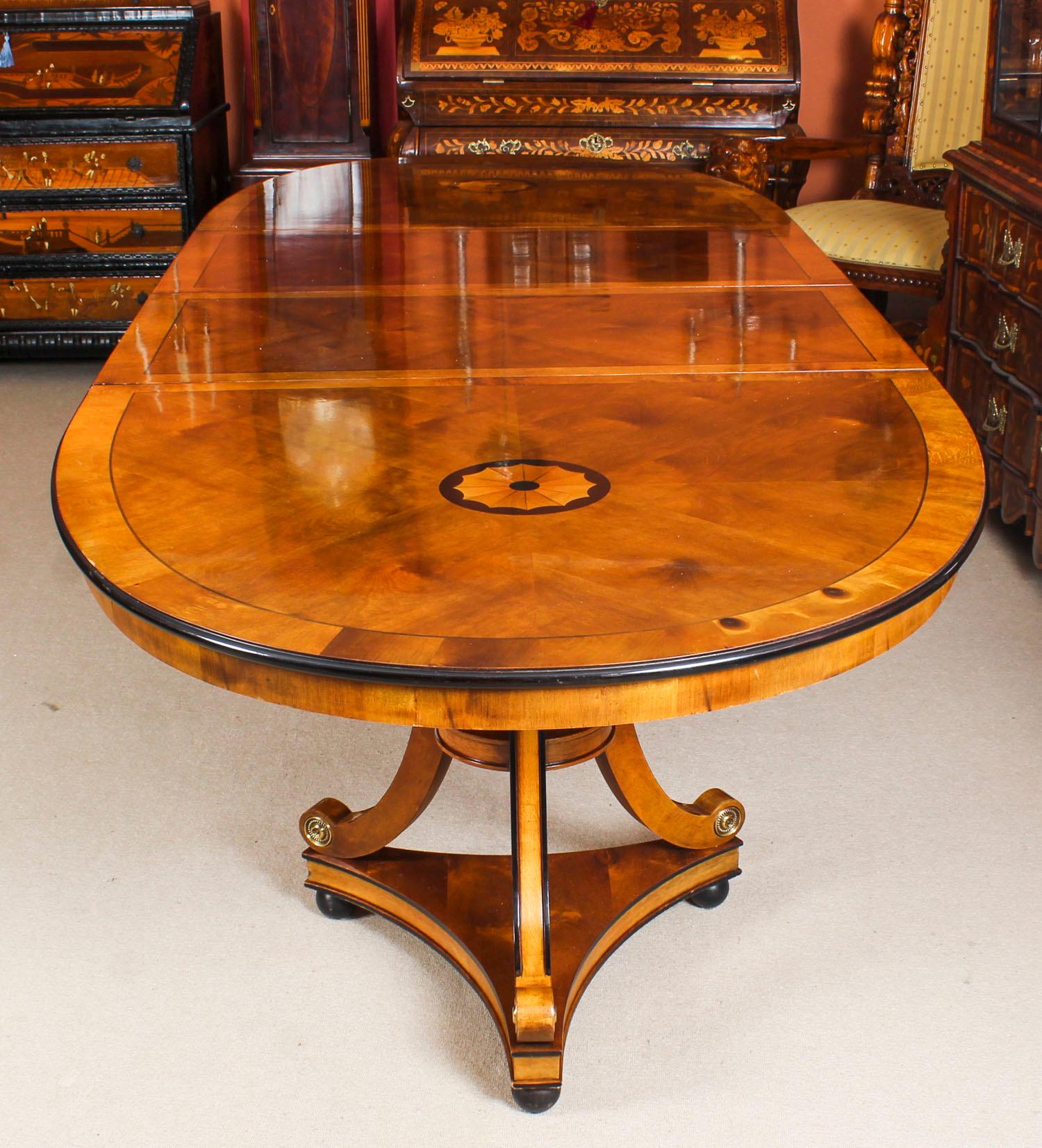 This is a fabulous high quality satin birch twin pillar oval dining table purchased at great expense from Harrods, Knightsbridge, London in the 1980s. Measures: 10ft 6”.

The oval top with inlaid circular satinwood and ebonized shell marquetry