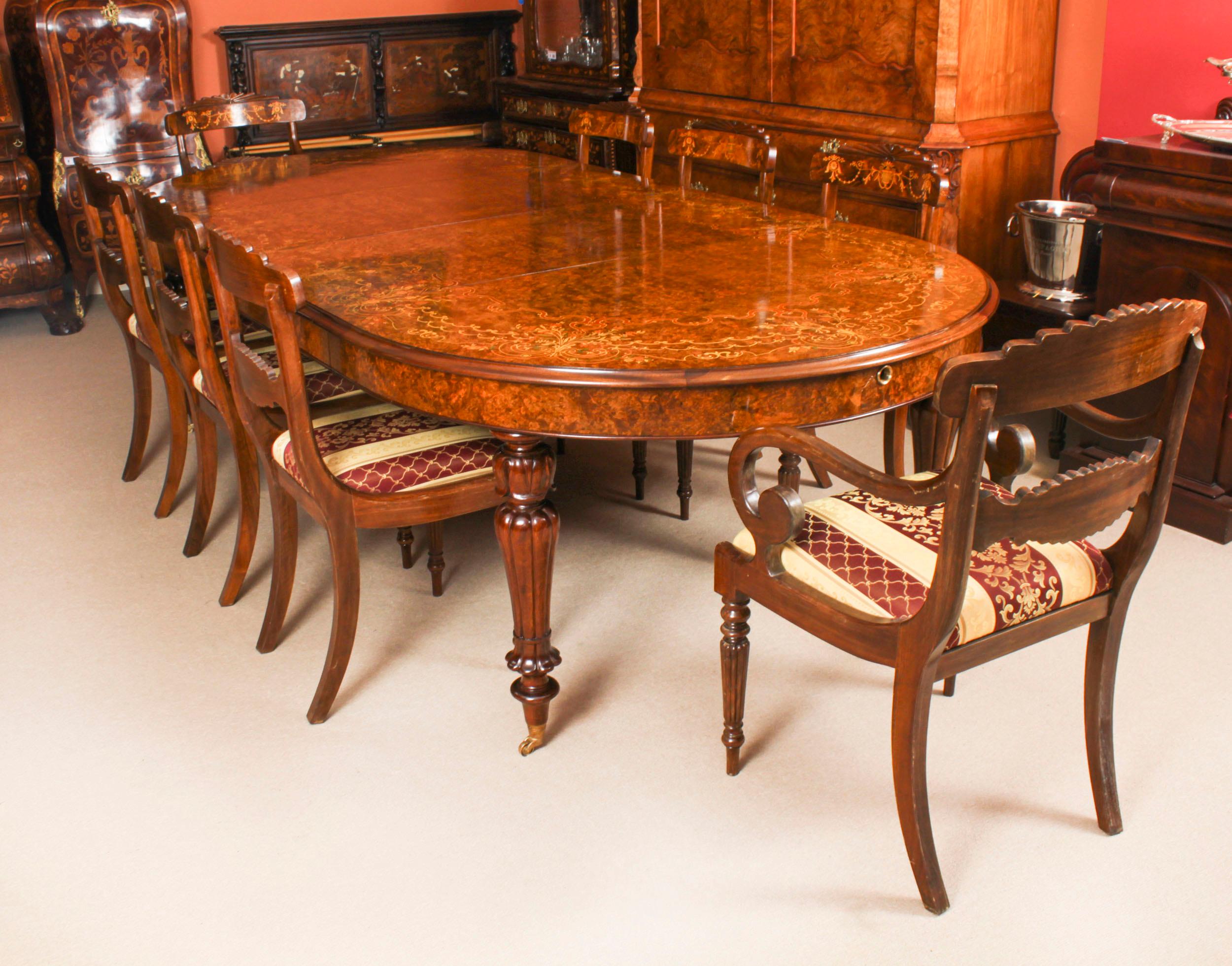 A fabulous Vintage burr walnut and floral marquetry 10ft dining table, dating from the late 20th Century.

It is made from burr walnut which  has a beautiful colour and grain and to highlight the grain it has been expertly French polished in our