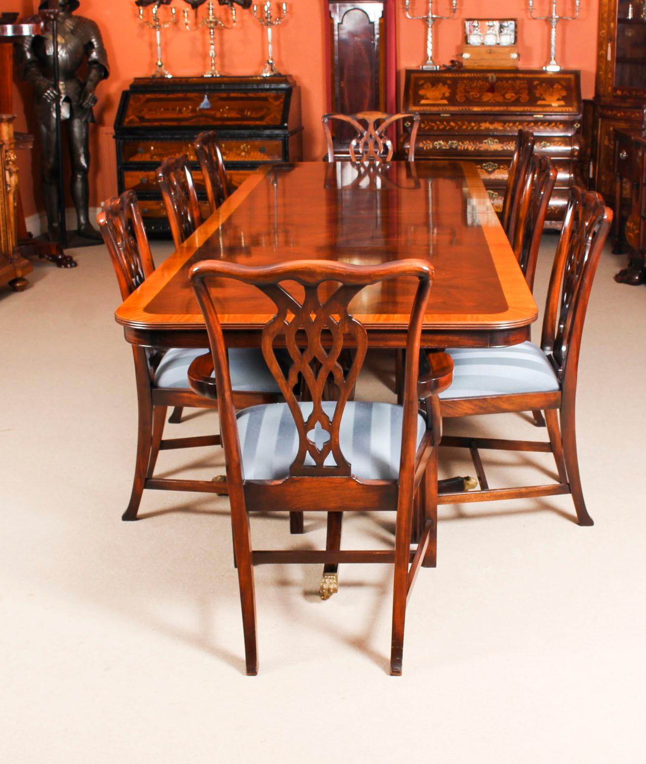 This is a beautiful dining set which comprises a flame mahogany twin pillar dining table and the matching set of eight chairs, mid-20th century in date.
There is no mistaking the fine craftsmanship of this handsome set, made by Rackstraw of