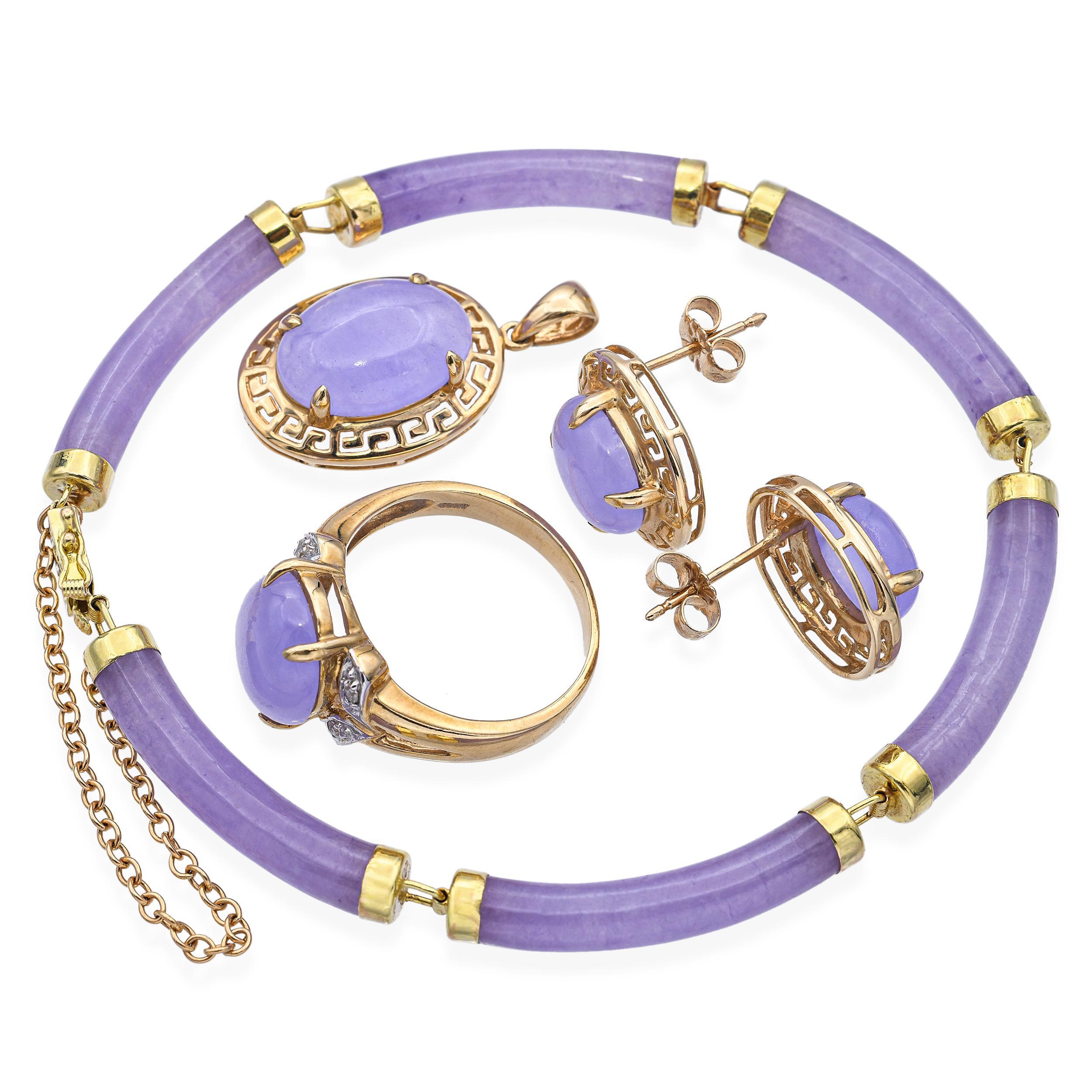 Graceful and serene, this vintage jewelry set features beautifully polished lavender jade set in warm 10k and 14k yellow gold. The soft, ethereal hue of the jade evokes tranquility and refinement, making this set a timeless expression of elegance.