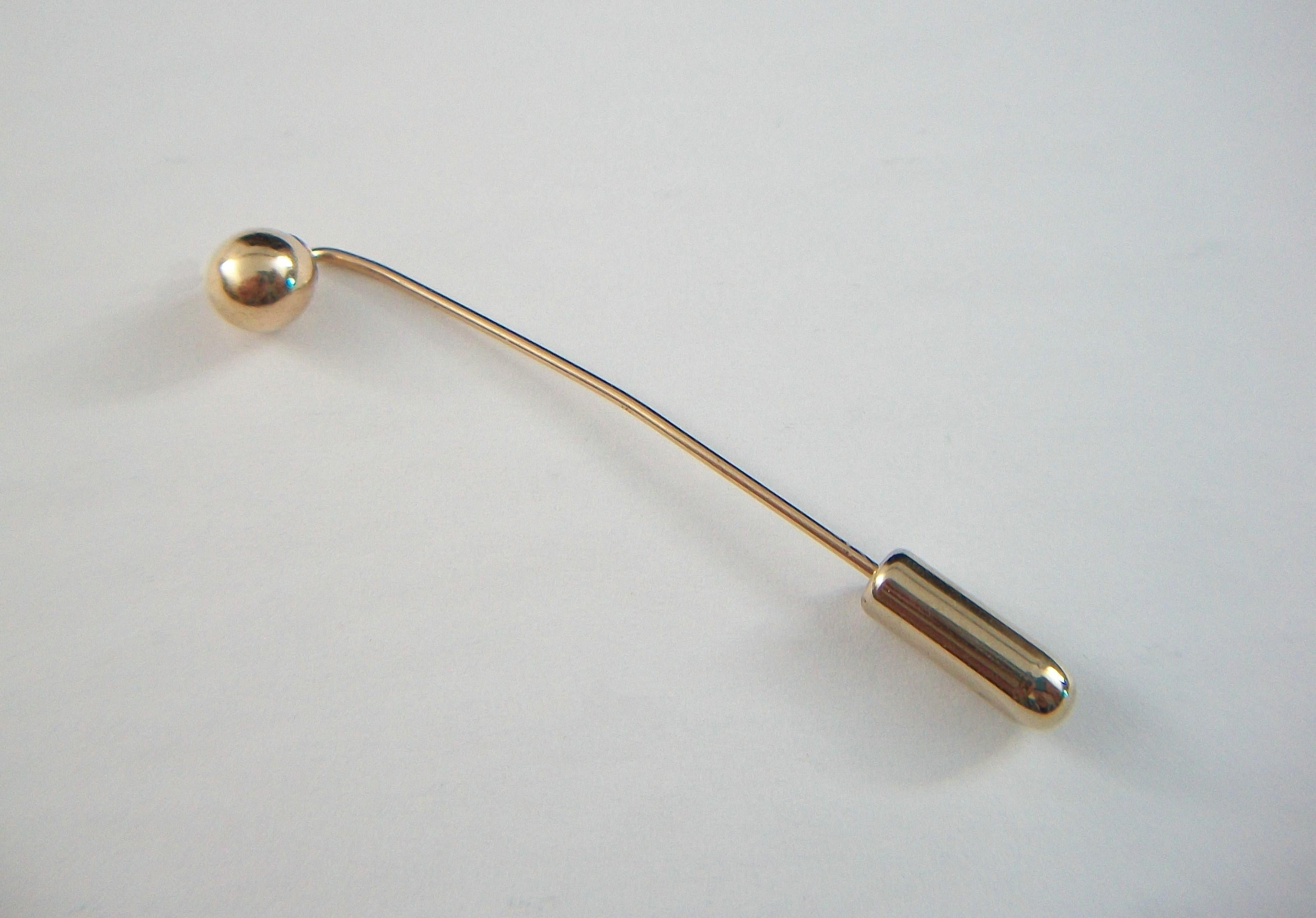 Vintage 10K yellow gold ball stick pin - featuring a gold sphere (6 mm. diameter) - hand made - stamped 10K on the pin - indistinct maker's mark (unknown/unidentified) - United States (likely) - circa 1980's.

Excellent vintage condition - all