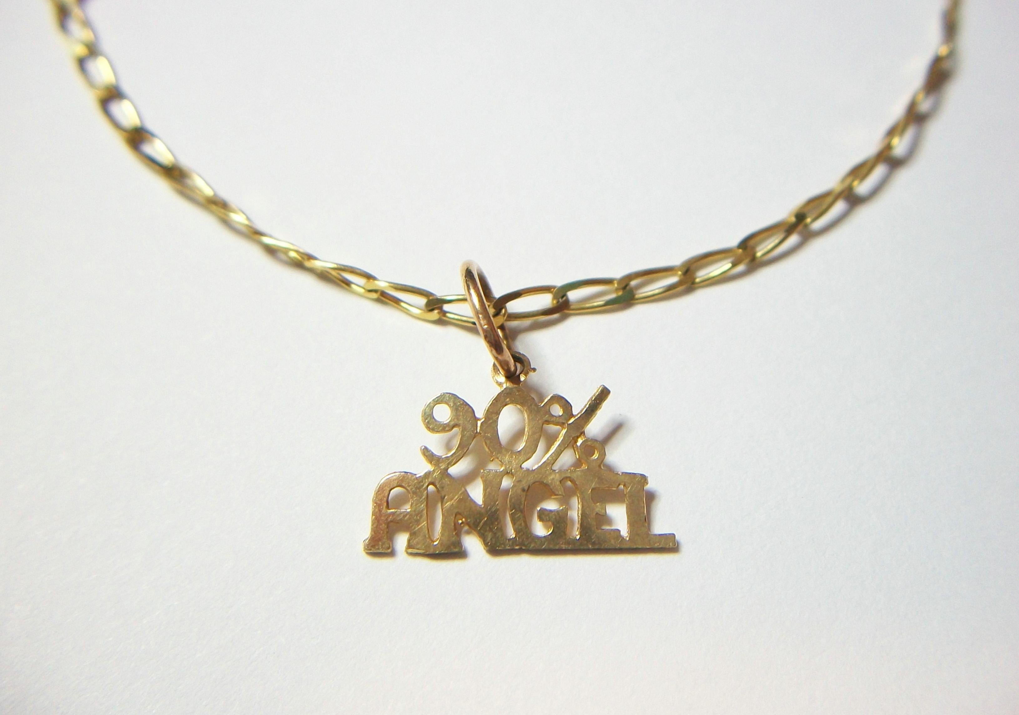 Vintage 10K or 417 yellow gold curb chain link bracelet - '90% ANGEL' charm - signed 'JL' and stamped 10K on the back of the charm - Italy - late 20th century.

Excellent vintage condition - minor surface scratches from age and use - no loss - no