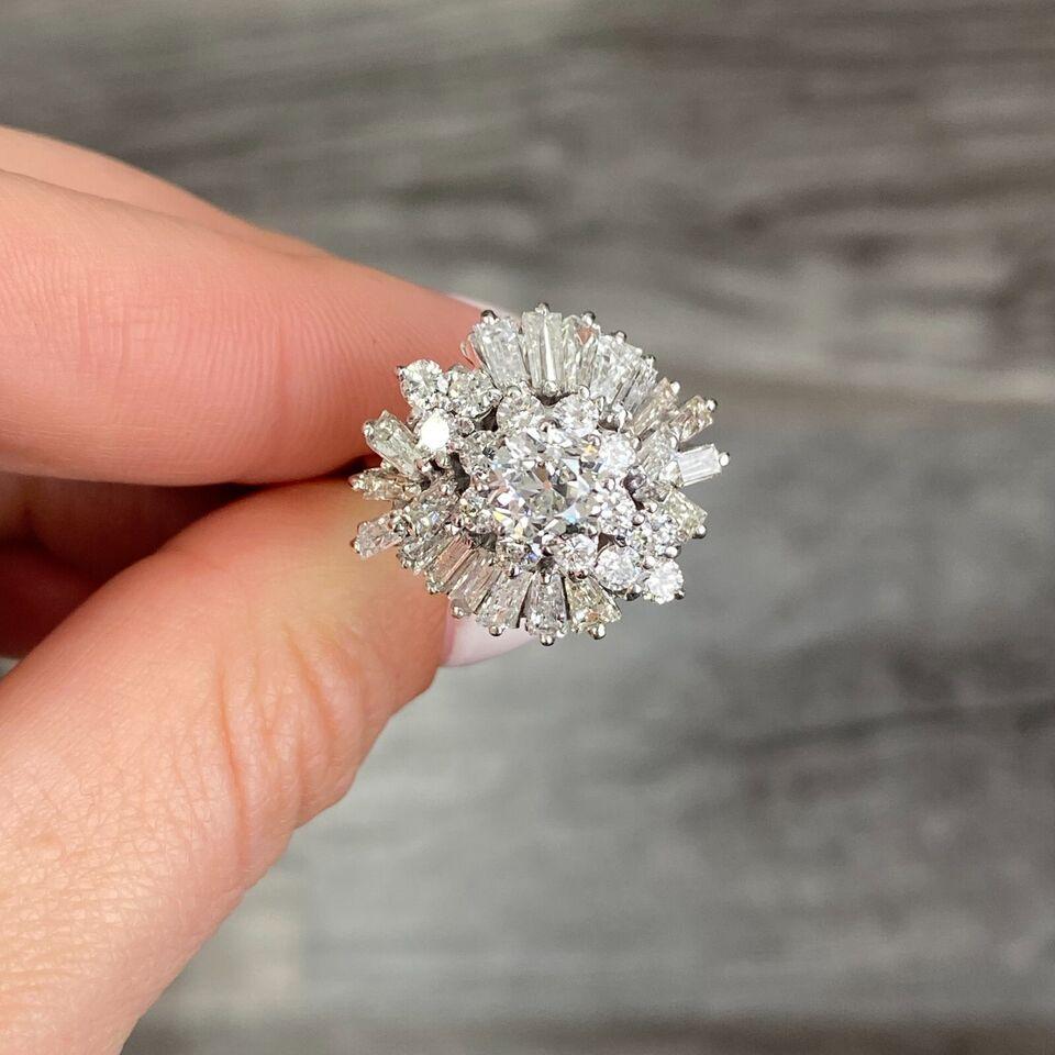 Specifications:
Metal: 10K White Gold(AU 42.6%), silver( AG38.1%); Palladium (PD 14.3%); Copper(CU2%)
Weight: 7.3 Gr
Main Stone: 1.03ct Old European cut Natural Diamond F SI2 EGLUSA Certified
Side stones:  Diamonds (approximately 2ctw)
Size: 7.5