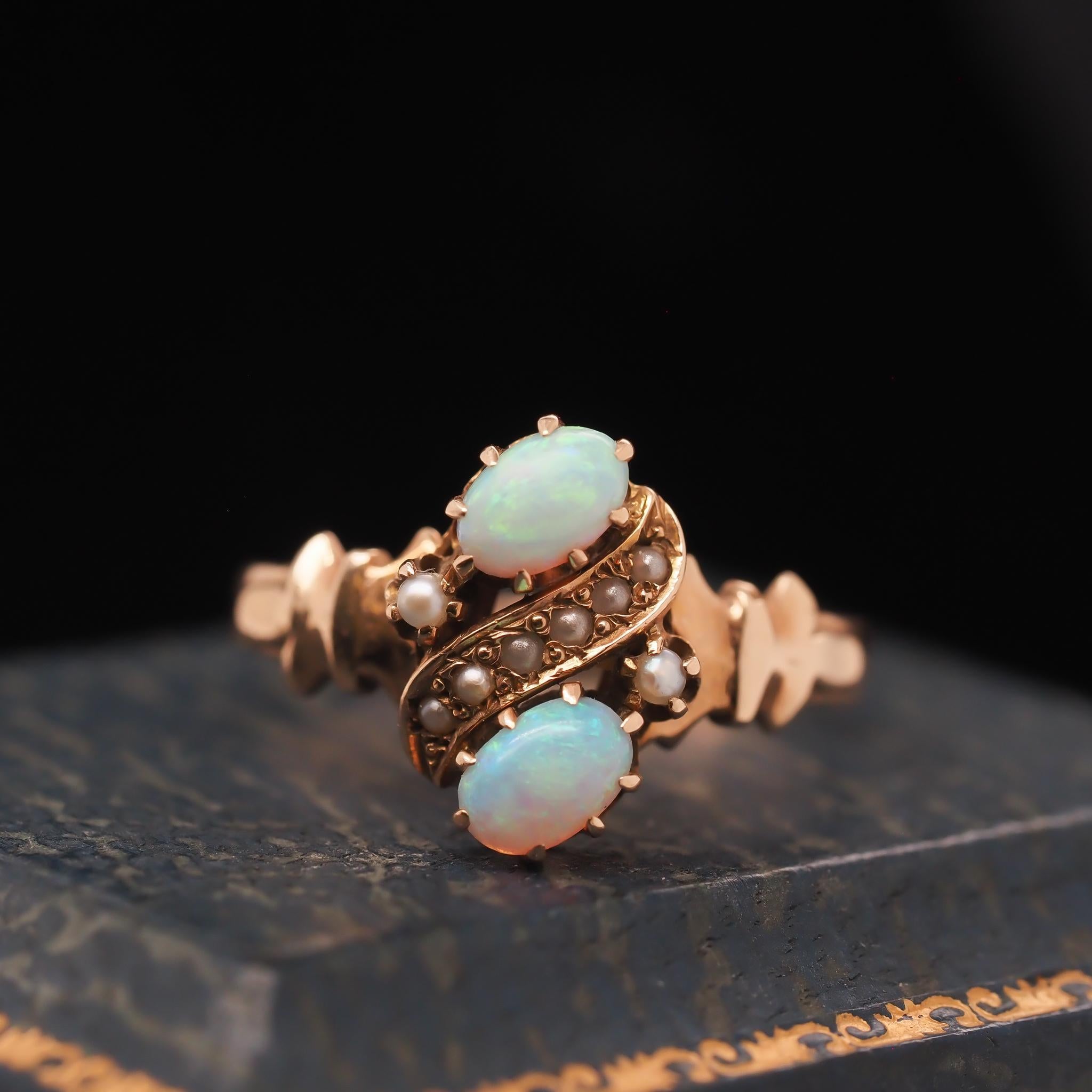 Year: 1930s
Item Details:
Ring Size: 8.25 (Sizable)
Metal Type: 10k yellow gold [Hallmarked, and Tested]
Weight: 2.5 grams
Opal Details: 1.00ct total weight, natural opal
Band Width: 2mm
Condition: Excellent
Era: Vintage
