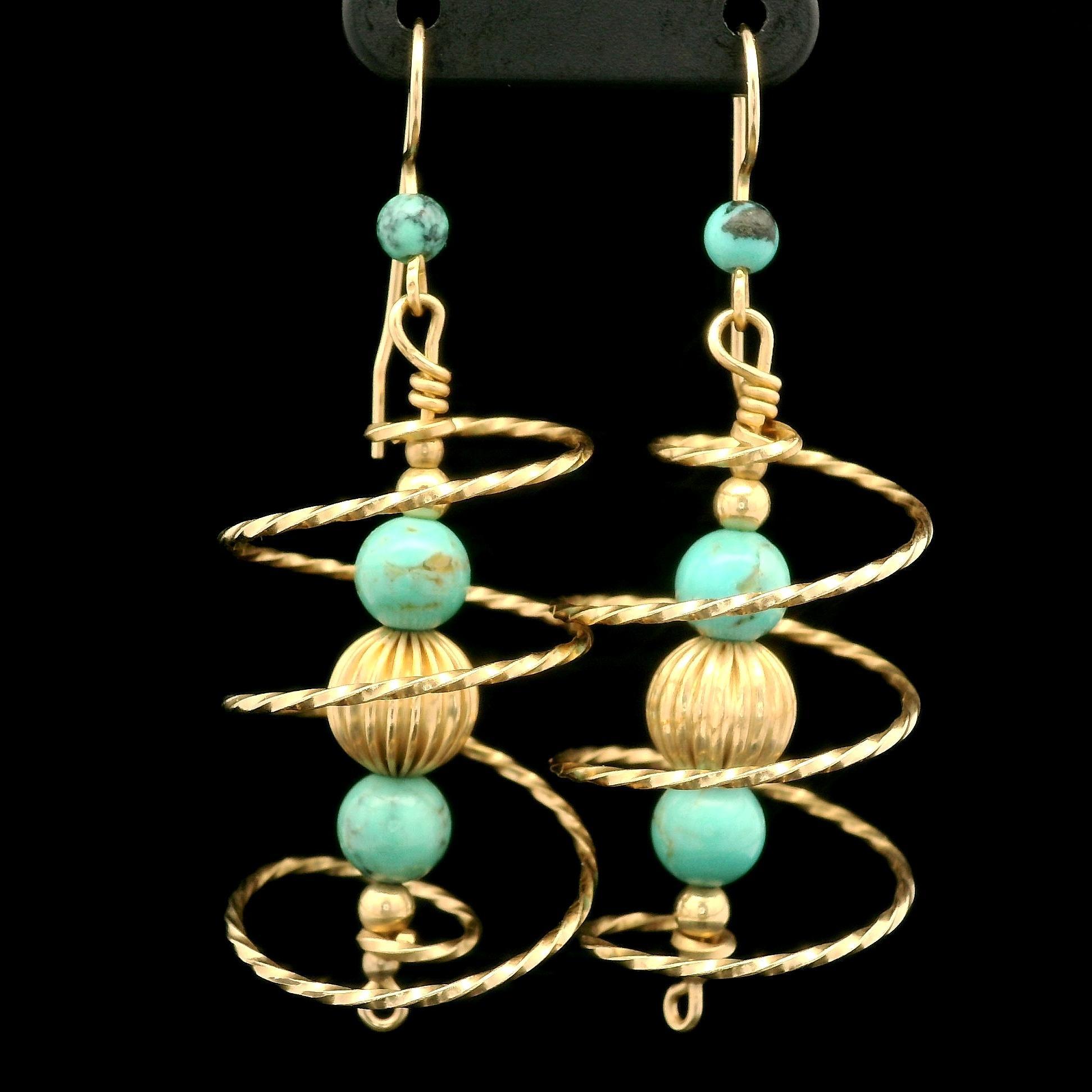 --Stone(s):--
(6) Natural Genuine Turquoise - Bead Ball Shape - Green Color - 3.8mm to 6.2mm each (approx.)

Material: Solid 10K Yellow Gold
Weight: 5.35 Grams
Backing: Wire Hook (Pierced ears are required. )
Overall Width: 20mm (0.79