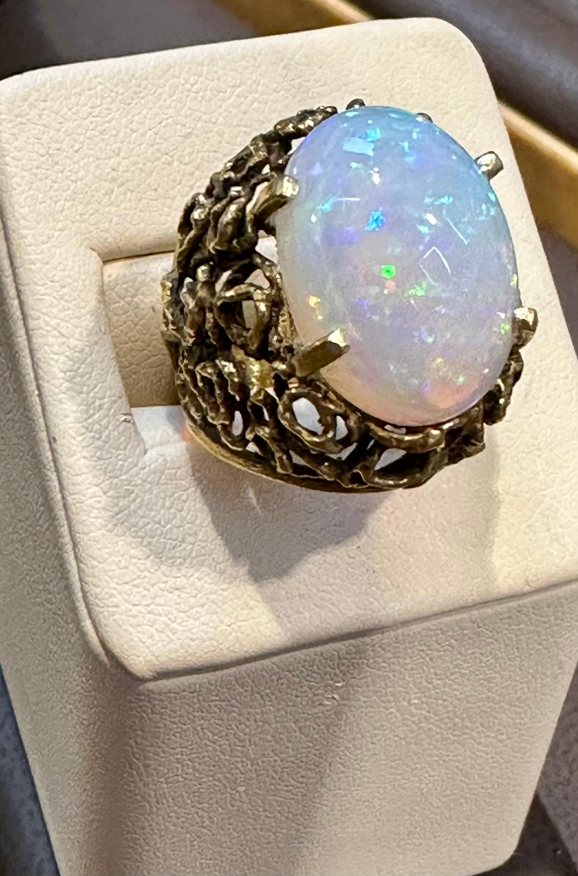 A Huge Cocktail ring 
Approximately 11 Carat Oval Ethiopian Opal  & Diamond Ring 14 Karat Yellow Gold Size 6
This spectacular Ring consisting of a single Oval Shape Ethiopian Opal Approximately 11 Carat. 

very clean Stone no inclusion , full of