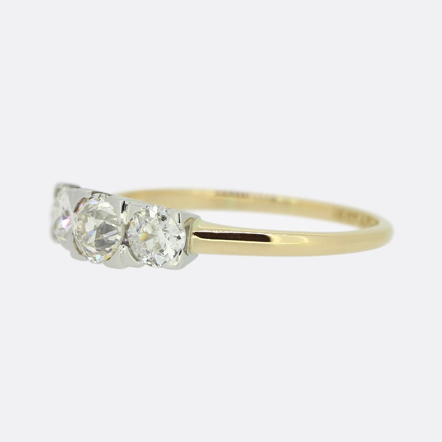 This is a vintage 18ct yellow gold old cut diamond three stone ring. The band of the ring is 18ct yellow gold and the diamonds sit in platinum, to emphasise their wonderful sparkle.

Condition: Used (Excellent)
Weight: 3.1 grams
Ring Size: Q
