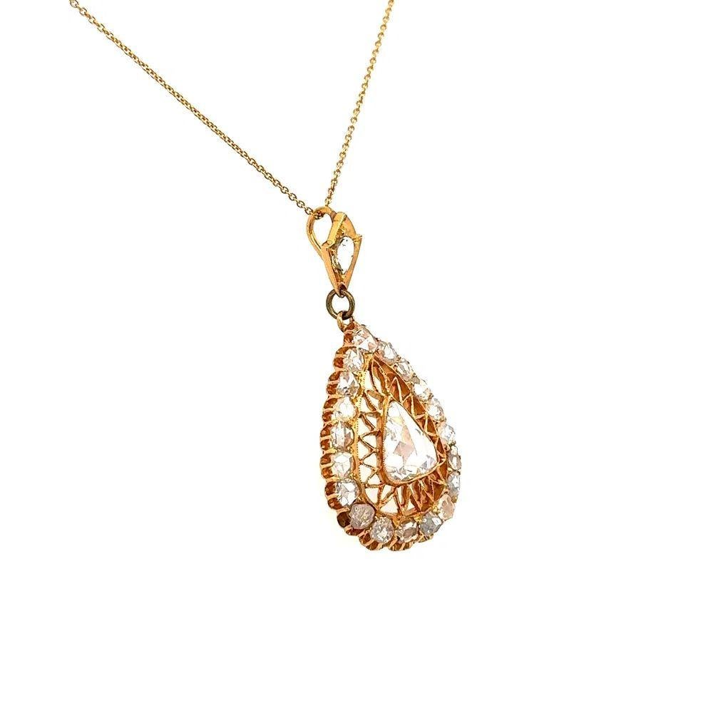 Simply Beautiful! Finely Detailed Vintage Rose Cut Diamond Gold Pendant Necklace. Centering a securely Hand set 1.10 Carat Pear Rose Cut Diamond. Surrounded by 2.35tcw Rose Cut Diamonds. Artistically Hand crafted 14K Yellow Gold mounting. Suspended