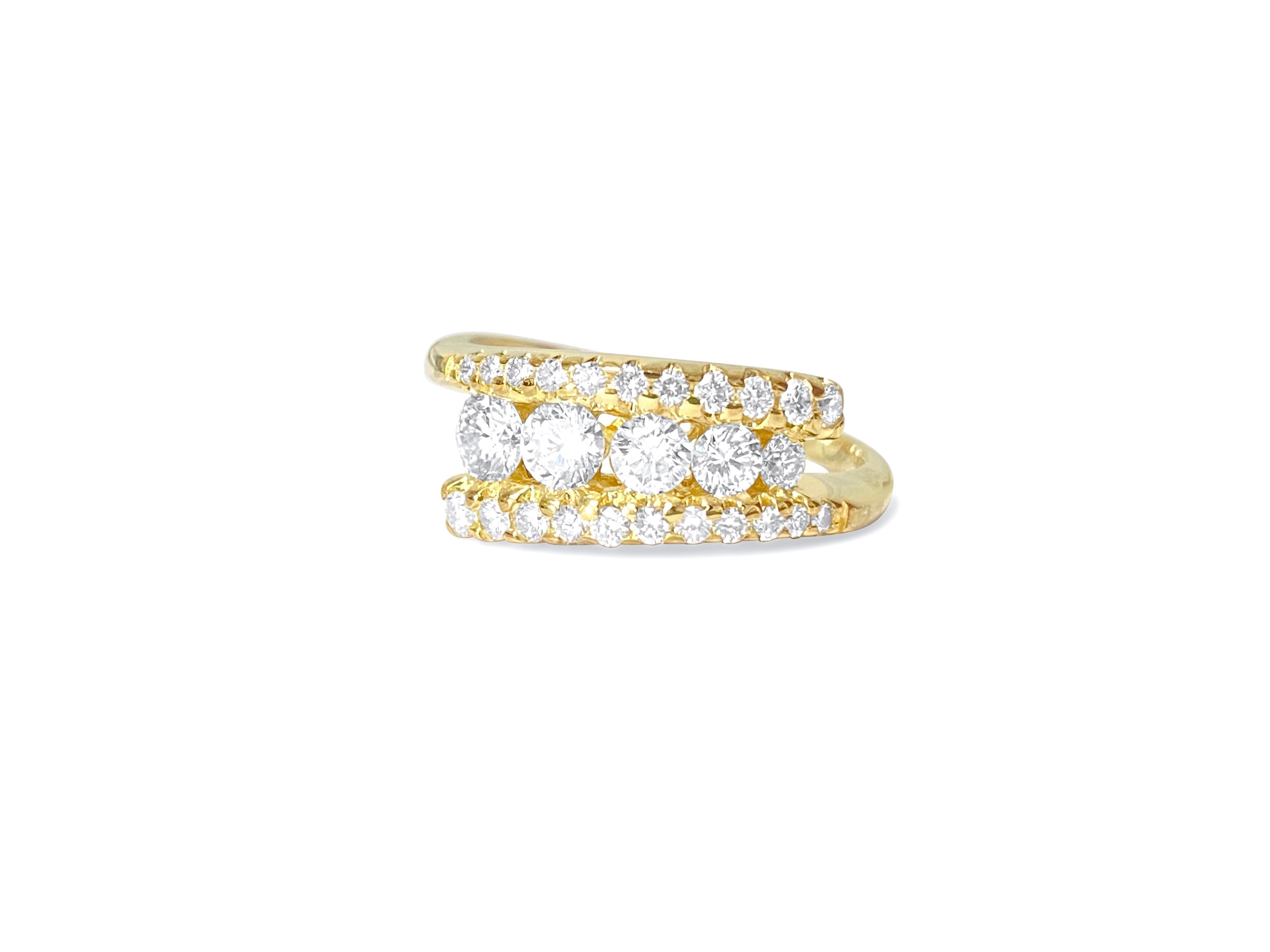 This ring is made of 14-karat yellow gold. It has diamonds that weigh 1.10 carats in total. The diamonds are clear and shiny, with a color range from F to G. They are cut in a round brilliant style. These diamonds are 100% natural and were mined