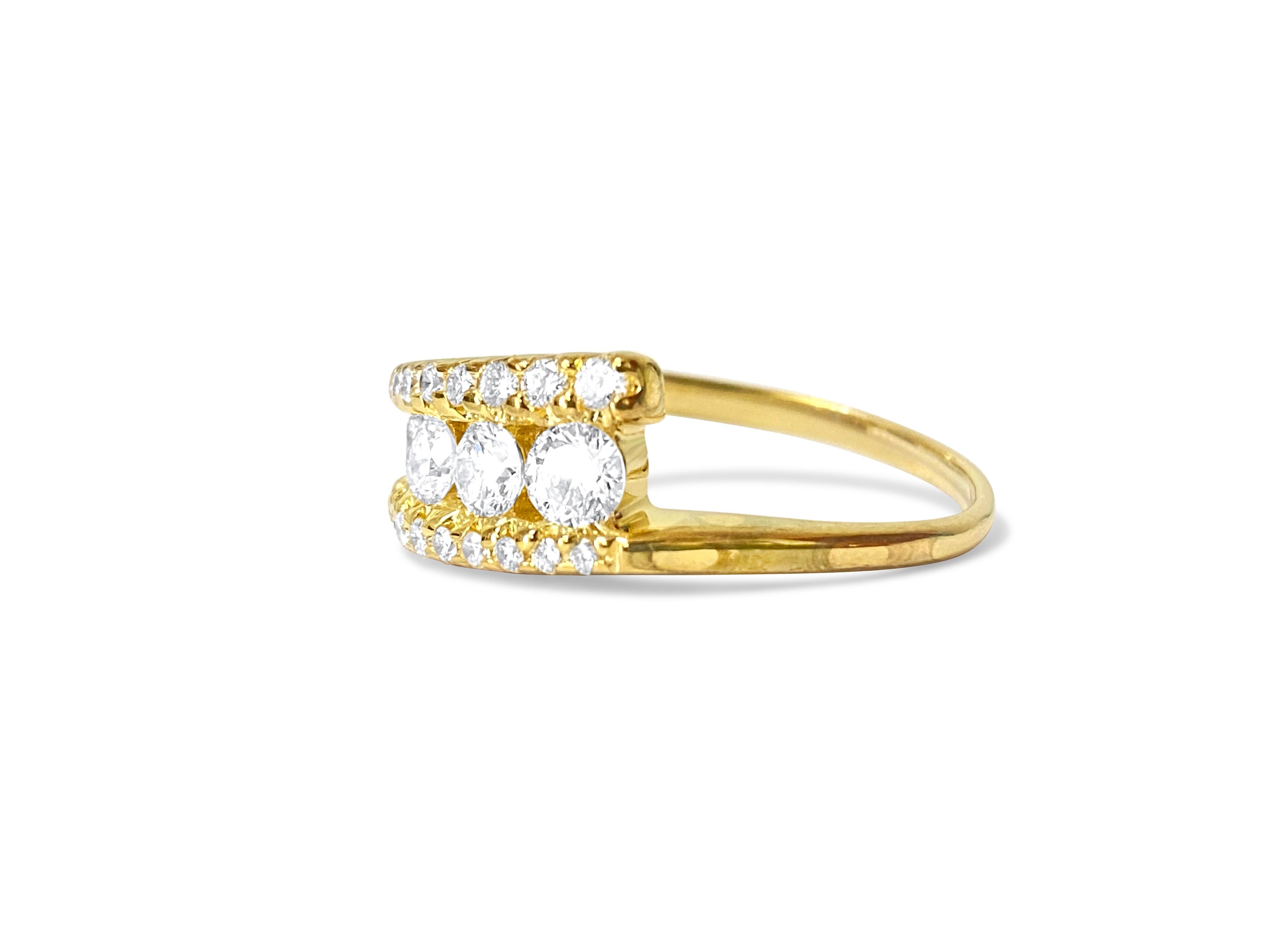This ring is made of 14-karat yellow gold. It has diamonds that weigh 1.10 carats in total. The diamonds are clear and shiny, with a color range from F to G. They are cut in a round brilliant style. These diamonds are 100% natural and were mined