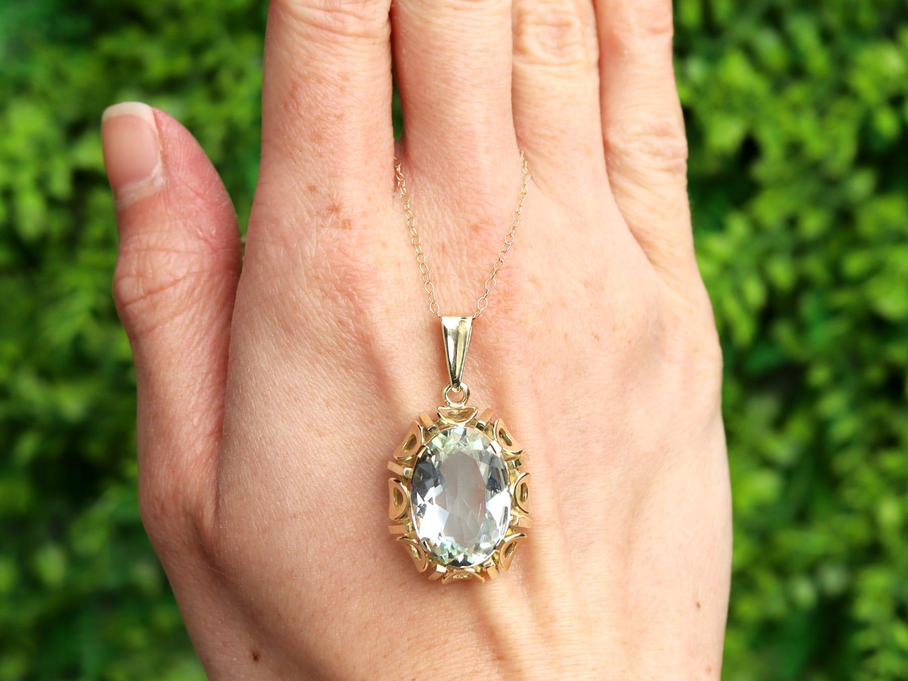 A fine and impressive 11.31 carat aquamarine and 14 karat yellow gold pendant; part of our diverse antique jewelry collections.

This fine and impressive vintage aquamarine pendant has been crafted in 14k yellow gold.

This substantial pierced