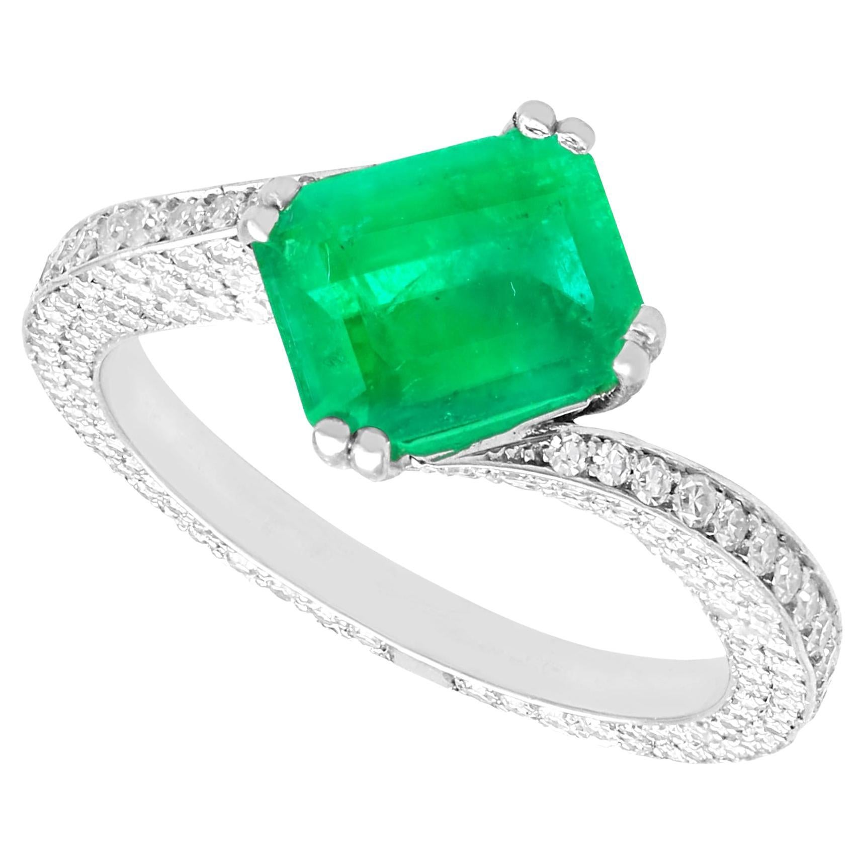 Vintage 1.13 Carat Emerald 2.20ct Diamond Platinum Twist Dress Ring, circa 1990 For Sale