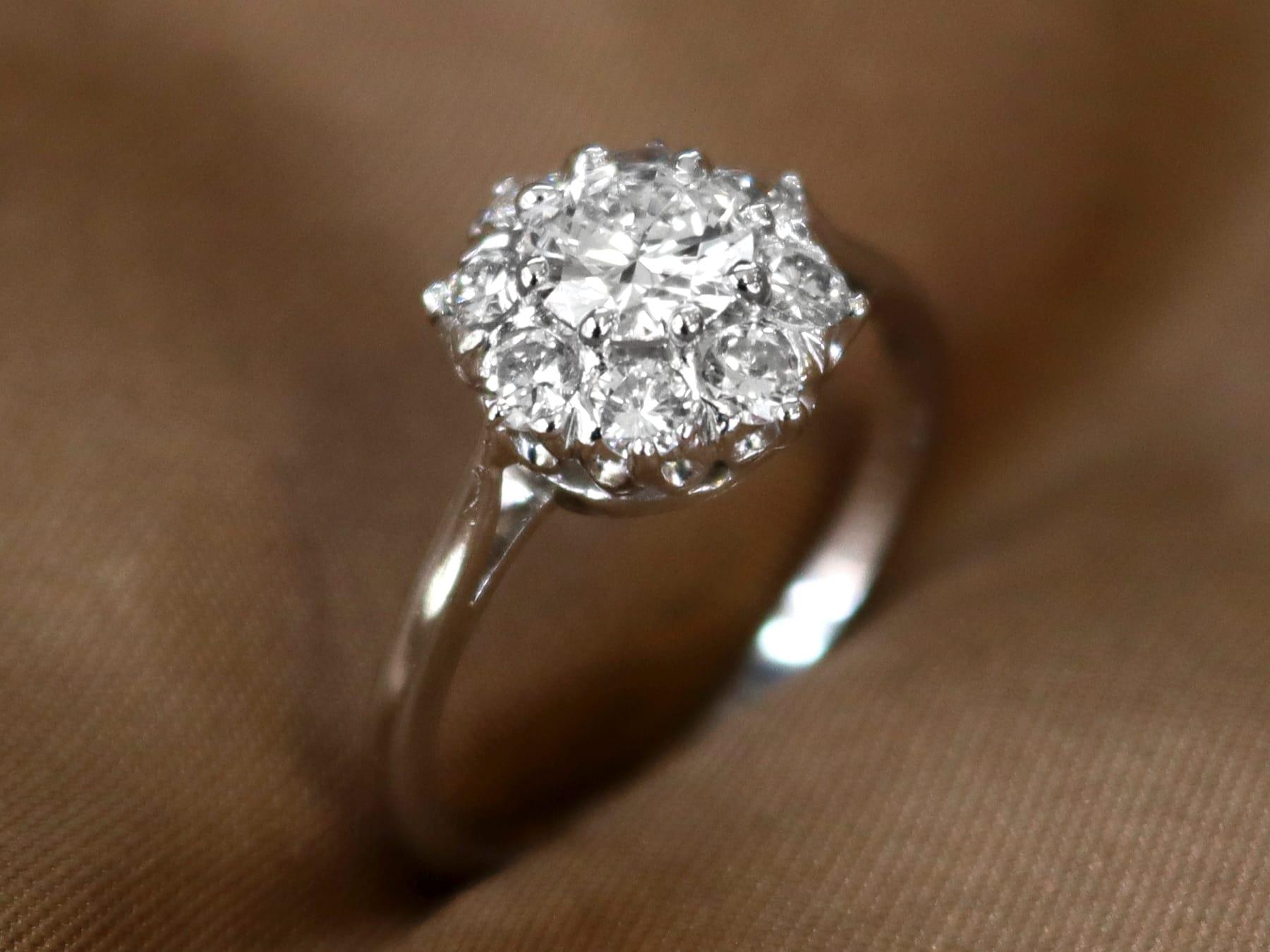 A stunning, fine and impressive vintage 1.14 carat diamond and platinum cluster ring; part of our diamond jewelry collections.

This stunning vintage diamond cluster ring has been crafted in platinum.

The pierced decorated frame displays a stunning