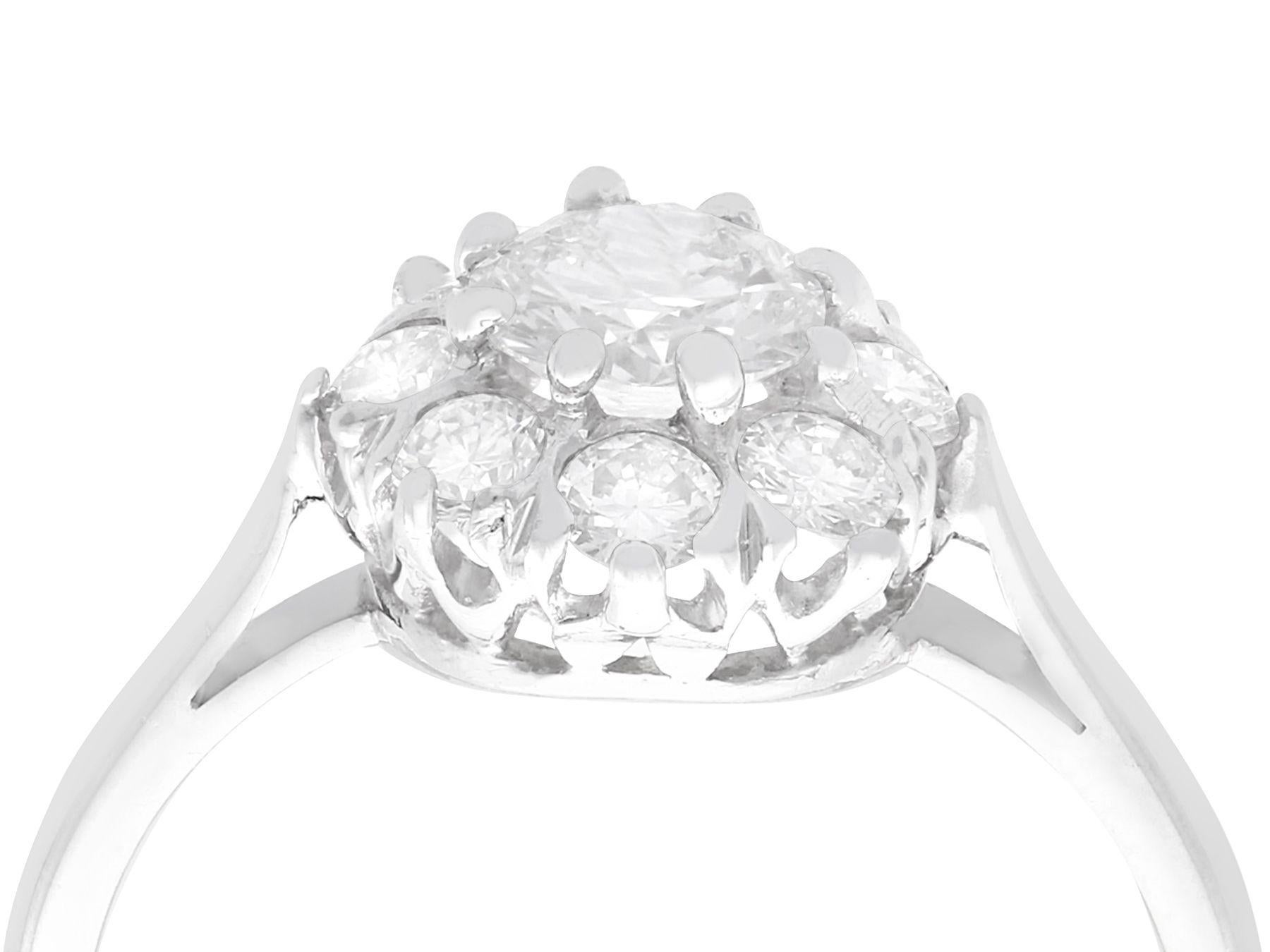 A stunning, fine and impressive vintage 1.14 carat diamond and platinum cluster ring; part of our diamond jewelry collections.

This stunning vintage diamond cluster ring has been crafted in platinum.

The pierced decorated frame displays a stunning