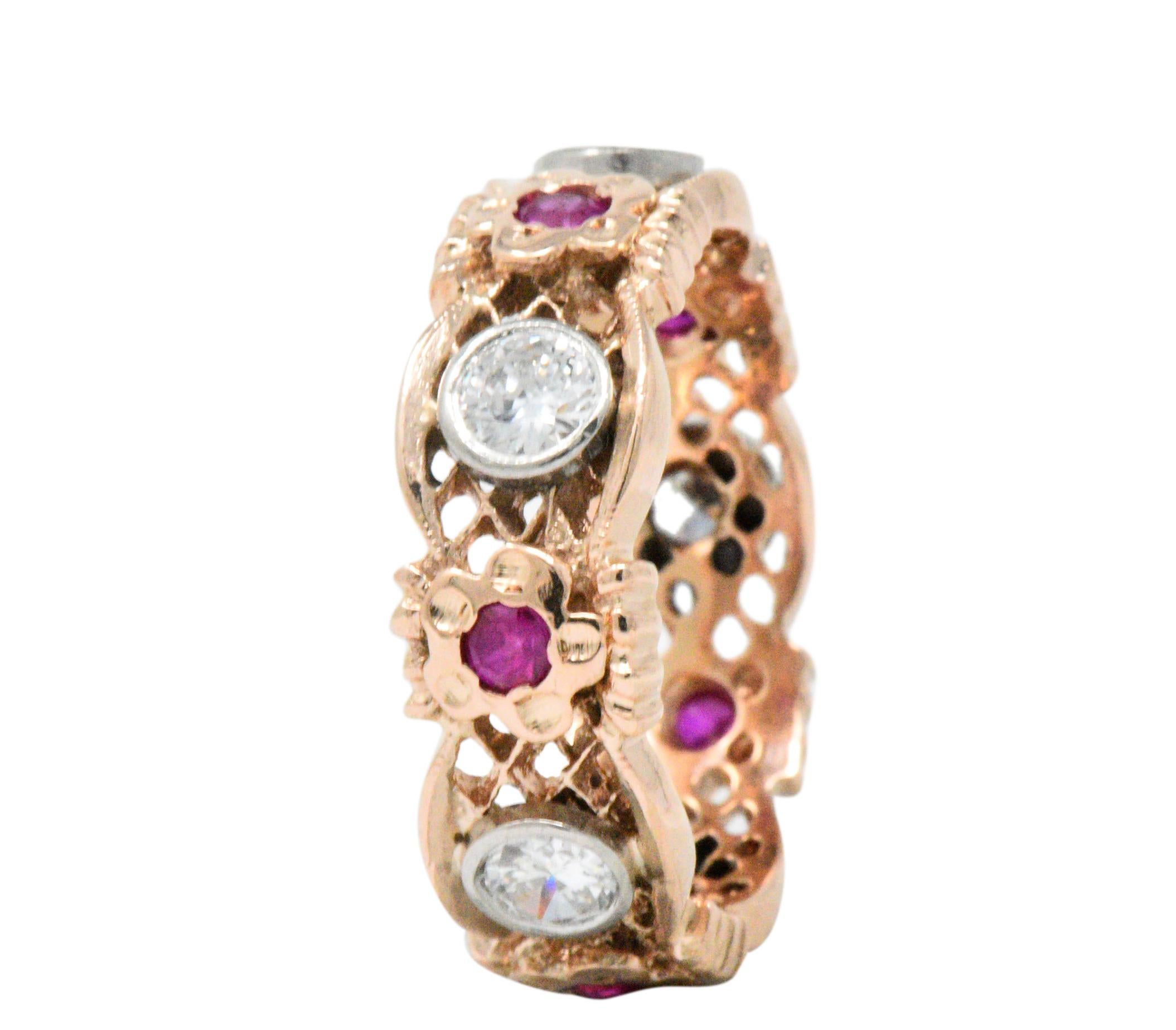 Featuring 5 round brilliant cut diamonds weighing approximately 1.15 carats total, G/H color and VS to SI clarity

Accented by 5 synthetic rubies, bright pinkish red color

Foliate and lattice rose gold band

Ring Size: 9 & Not Sizable

Top measures