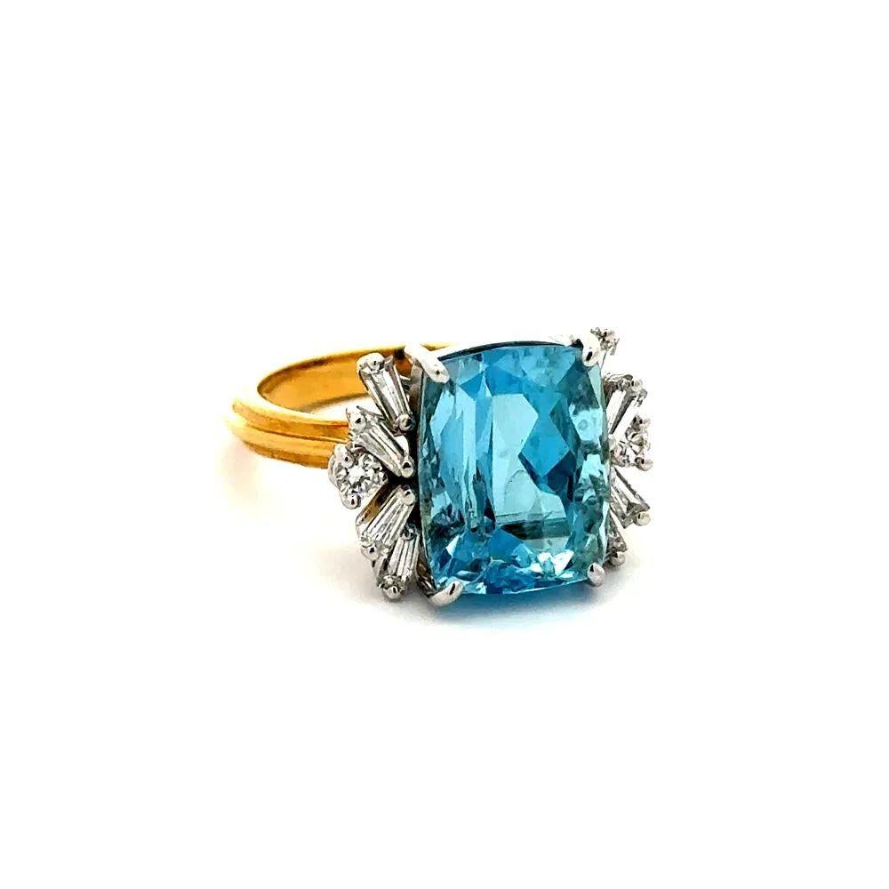 Simply Beautiful! Aquamarine and Diamond Gold Cocktail Ring. Centering a securely nestled Hand set Emerald-Cut Aquamarine, weighing approx. 11.50 Carat. Both sides of ring Hand set with Baguette and RBC Diamonds, approx. 0.40tcw. Hand crafted 2-Tone
