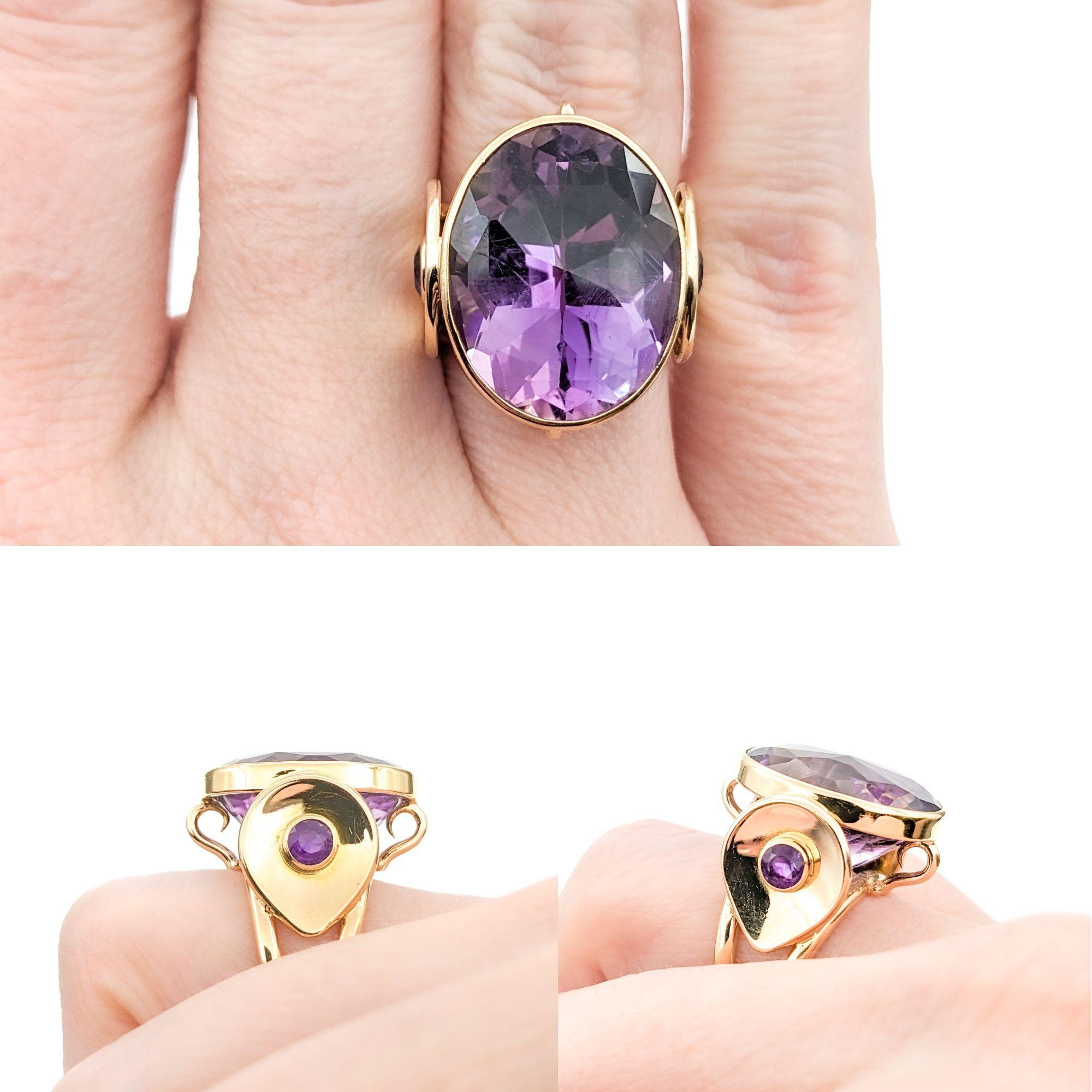 Vintage 11.50ct Amethyst Ring In Yellow Gold

Introducing this beautiful Vintage Ring crafted in 14kt yellow gold. This ring features a stunning 11.50ct oval Amethyst centerpiece, flanked by .30ctw of complementary amethysts, creating a regal and