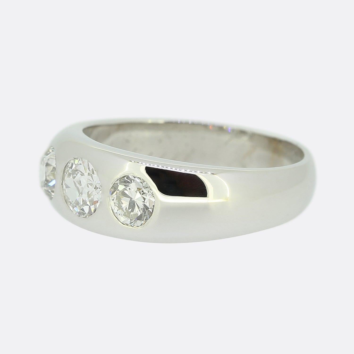 Here we have a classically styled three-stone diamond ring. Crafted from platinum, this vintage piece showcases a trio of round faceted old cut diamonds; the largest of which sits at the centre of face weighing 0.60 carats. All stones here have been
