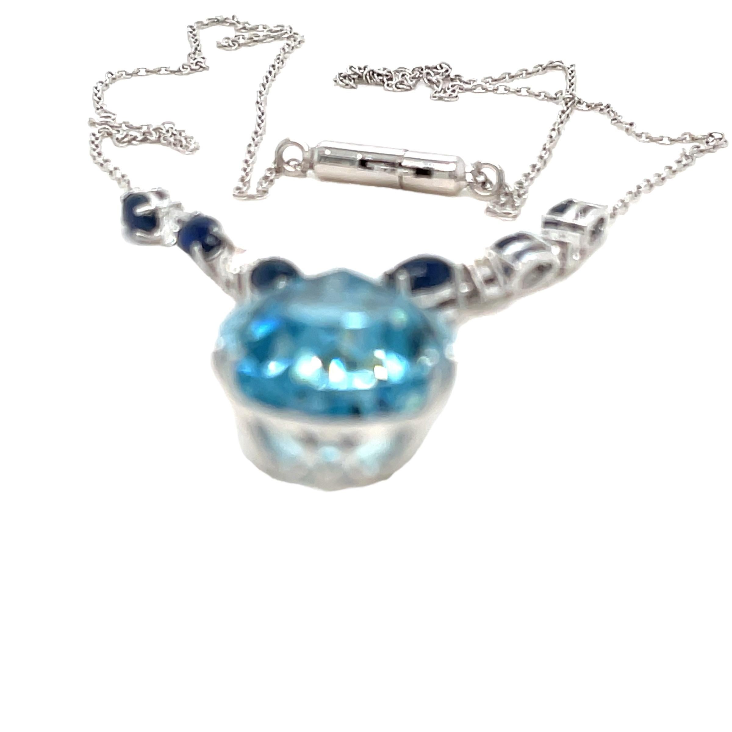 An impressive vintage 1960's 18k white gold necklace set with one large exquisite pear shape Natural Aquamarine, for a total weight of 11,90 Carats, surrounded by one large round cut Diamond and 4 smallest in a white gold setting - total weight 0,50
