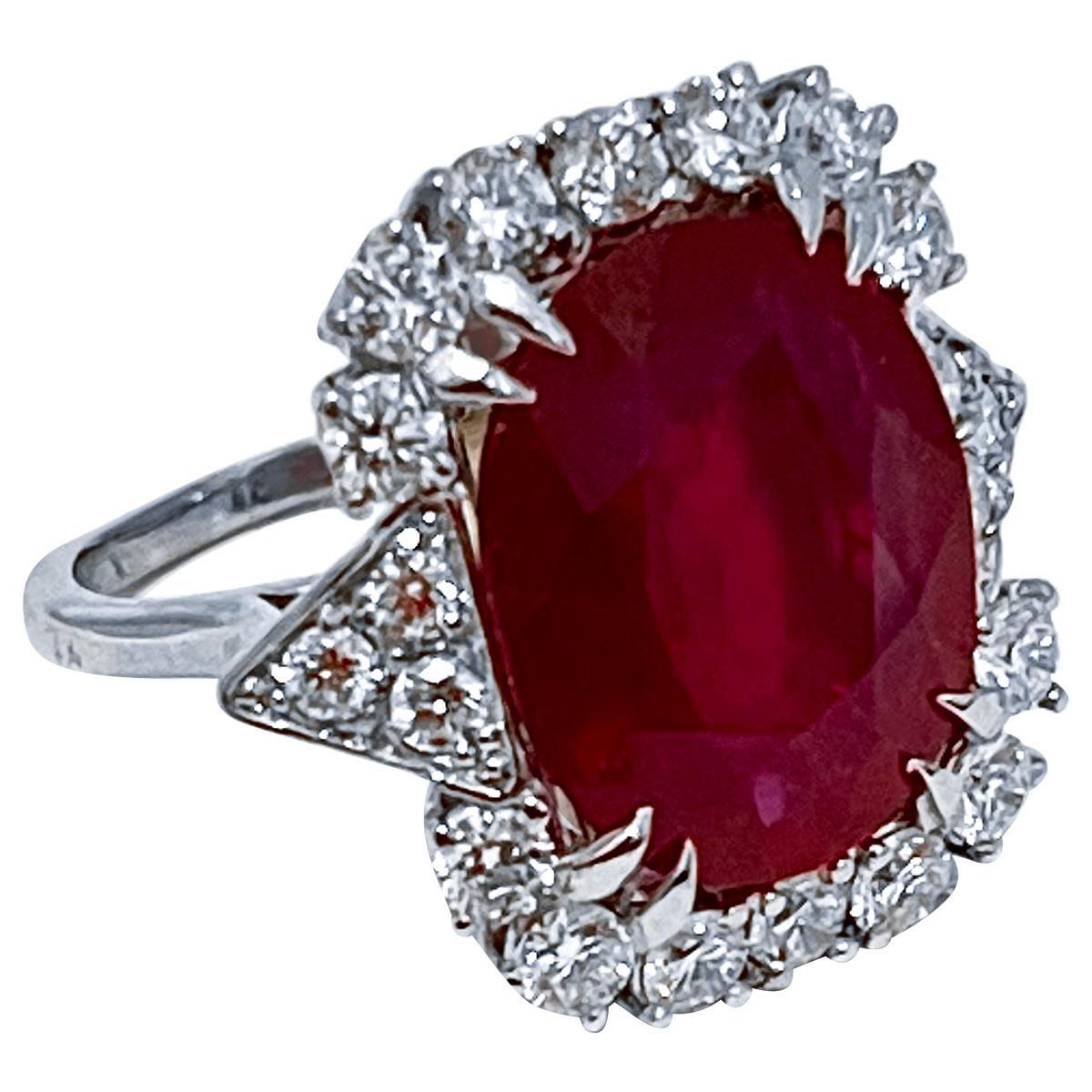 approximately 12 Carat Emerald shape Treated Ruby And Diamond Platinum Ring Size 6
 Double prong set, Just beautifully done 
Platinum 9.2 Grams
Ring Size 6 ( can be altered for no charge )

Diamonds:  approximate 2 Carat , all brilliant round cut