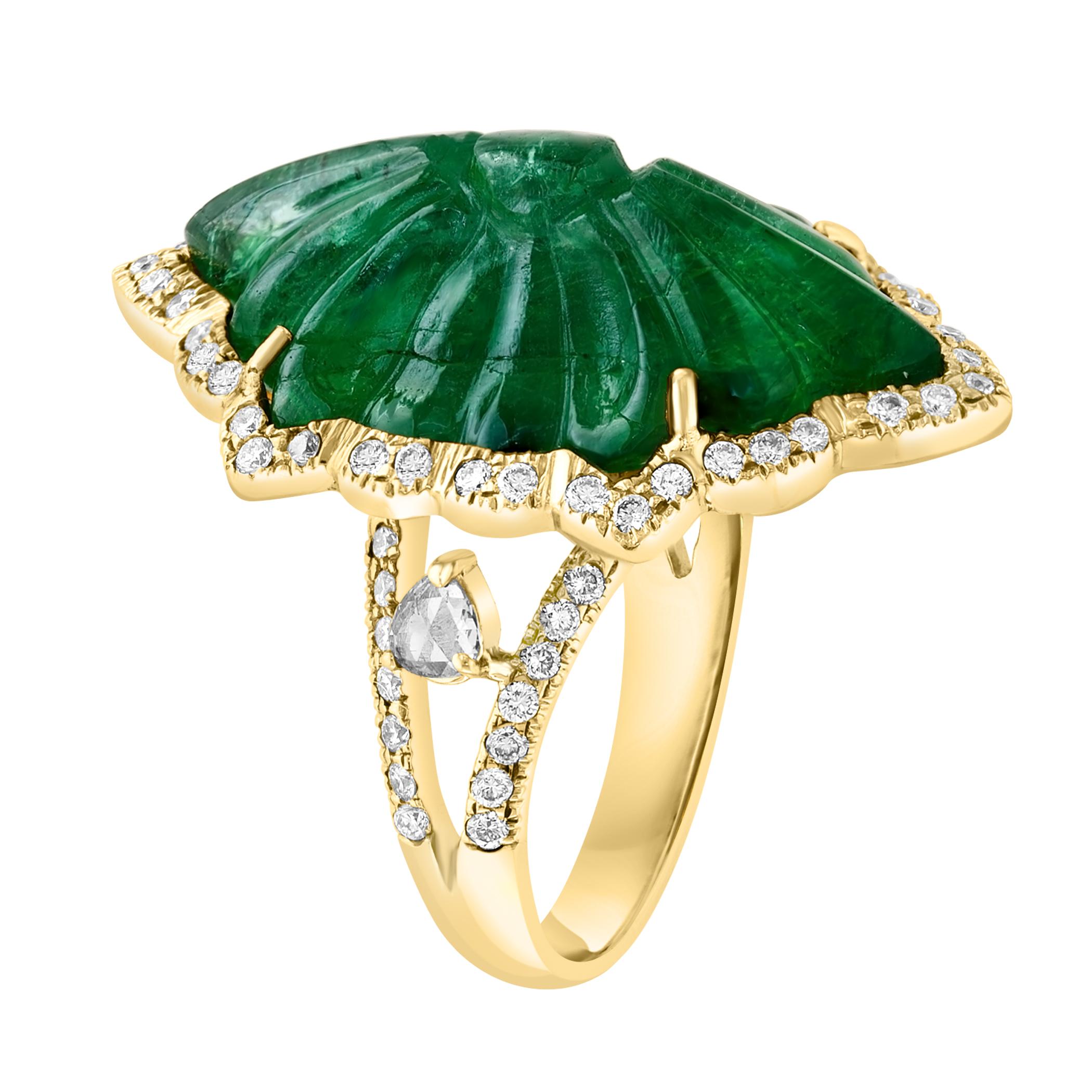 Vintage 18 Karat Yellow Gold Ring Size 6.5 featuring a single solitaire natural carved emerald approximately 12 ct with beautiful color and clarity. Accompanied by brilliant cut diamonds approximately 1.5 ct. The ring weighs 12.1 gm and can be