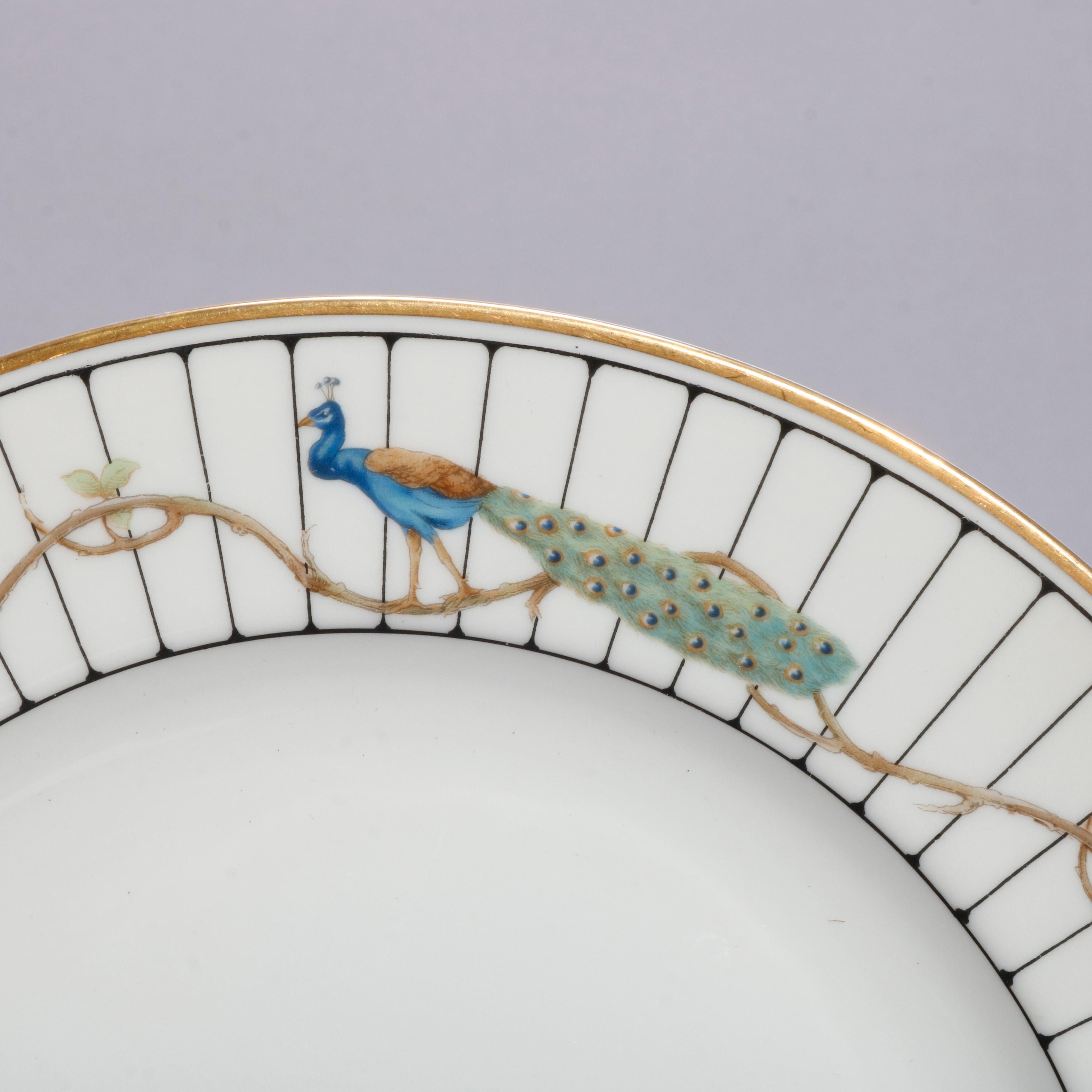 A vintage set of 12 German fine China dinner plates by Rosenthal offer rims with peacocks and gilt trim, en verso maker mark, 20th century

Measures: .75