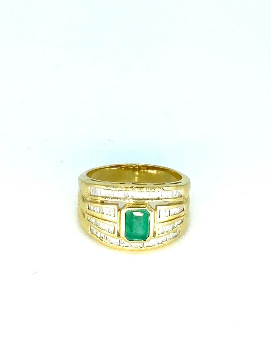 Vintage 1.20 Carat Emerald and Diamonds 4-Row Ring 18k Gold. The center emerald weights approx 0.50 carat and the tapered baguettes featured in the 4-rows weight approx 0.70 carat. The ring is a size 6.5 and weights 6.6 grams solid 18k gold.