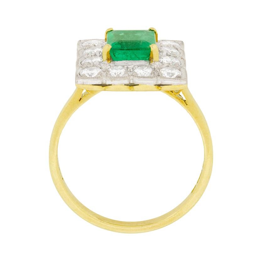 A vibrant green emerald is surrounded by a halo of diamonds in this beautiful cocktail ring. The 1.20 carat emerald is emerald-cut and is held by 18 carat yellow gold claws. The halo consists of 1.20 carat of brilliant cut diamonds, they are F