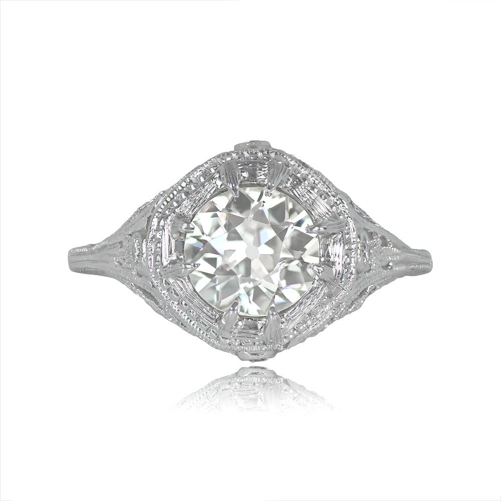 This exquisite vintage ring showcases a 1.20-carat old European cut diamond set in prongs, with characteristics of L color and VS2 clarity. The ring's 14k white gold setting is elegantly accented with delicate milgrain detailing. It is a vintage