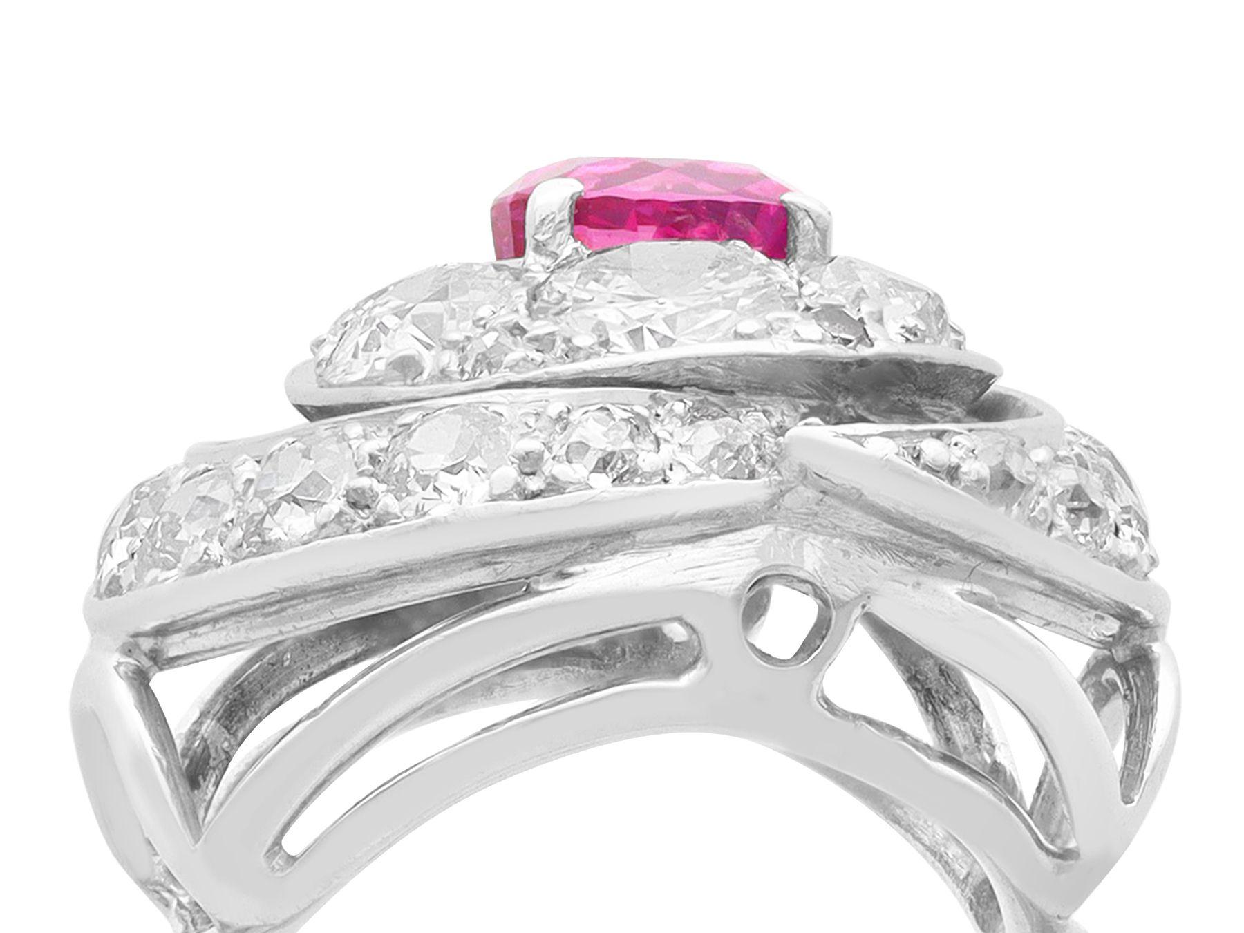 A stunning vintage 1.22 carat pink sapphire and 2.73 carat diamond, 18 karat white gold dress ring; part of our diverse vintage jewelry and estate jewelry collections

This fine and impressive vintage sapphire and diamond ring has been crafted in