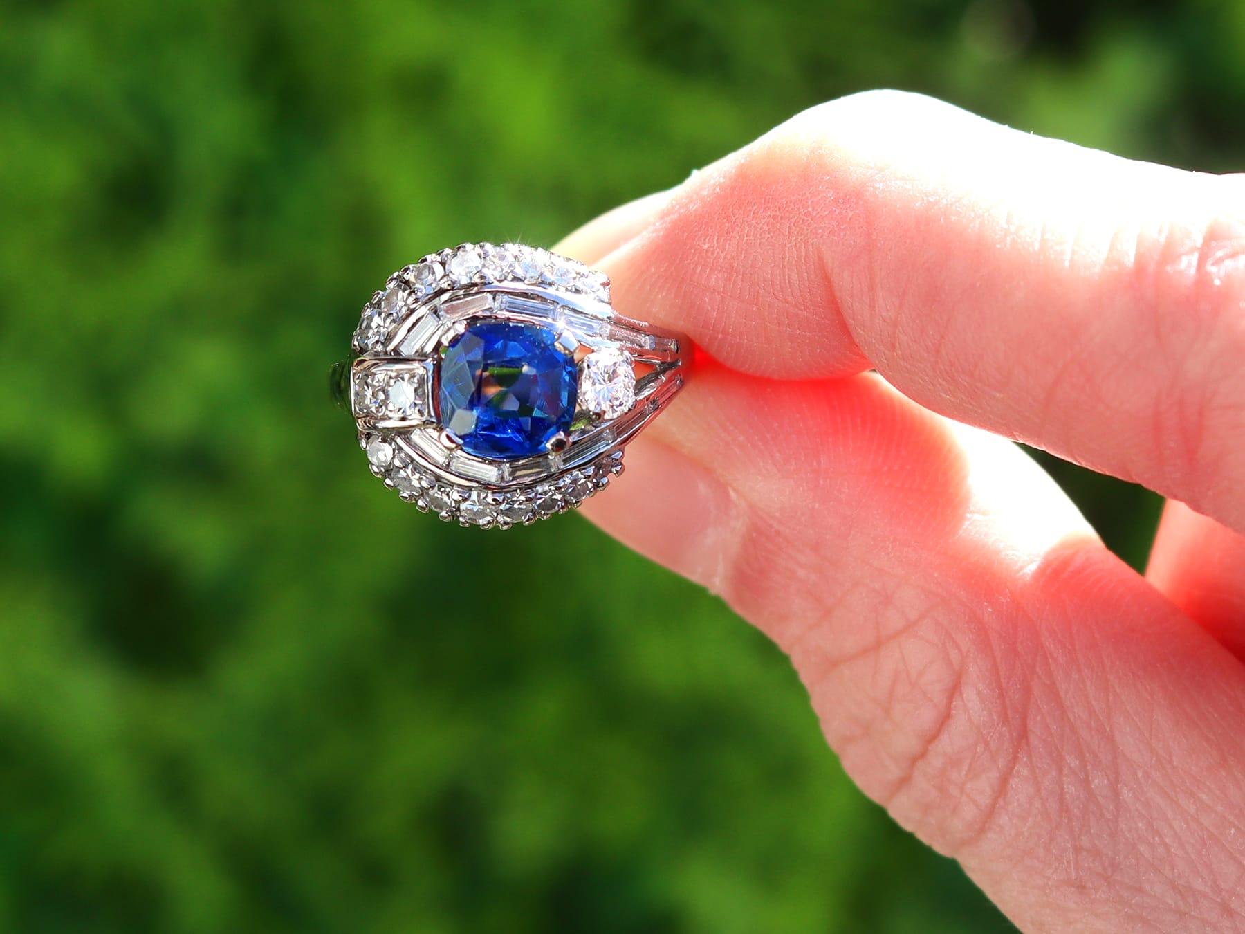 A fine and impressive vintage 1.24 carat Basaltic sapphire and 0.70 carat diamond, 14 karat white gold dress ring; part of our diverse vintage estate jewelry collections.

This stunning, fine and impressive vintage sapphire and diamond ring has been