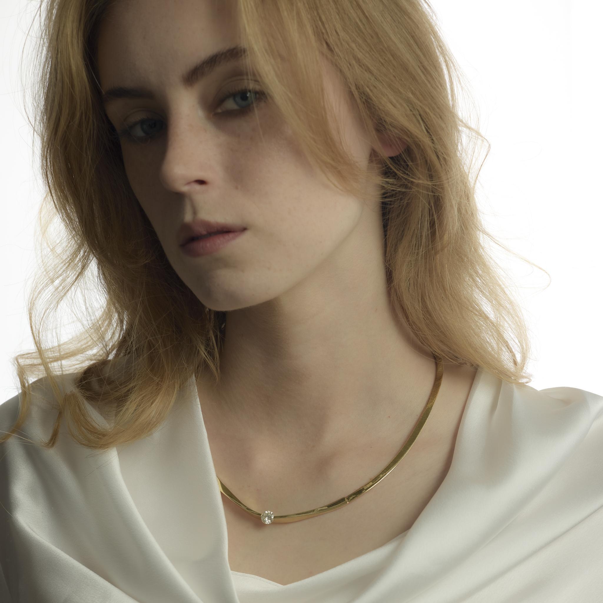 This vintage 1990’s Italian necklace is crafted in substantial 14k yellow gold and set with 1.25 carats of sparkling round brilliant cut diamonds, blending timeless elegance with bold sophistication.