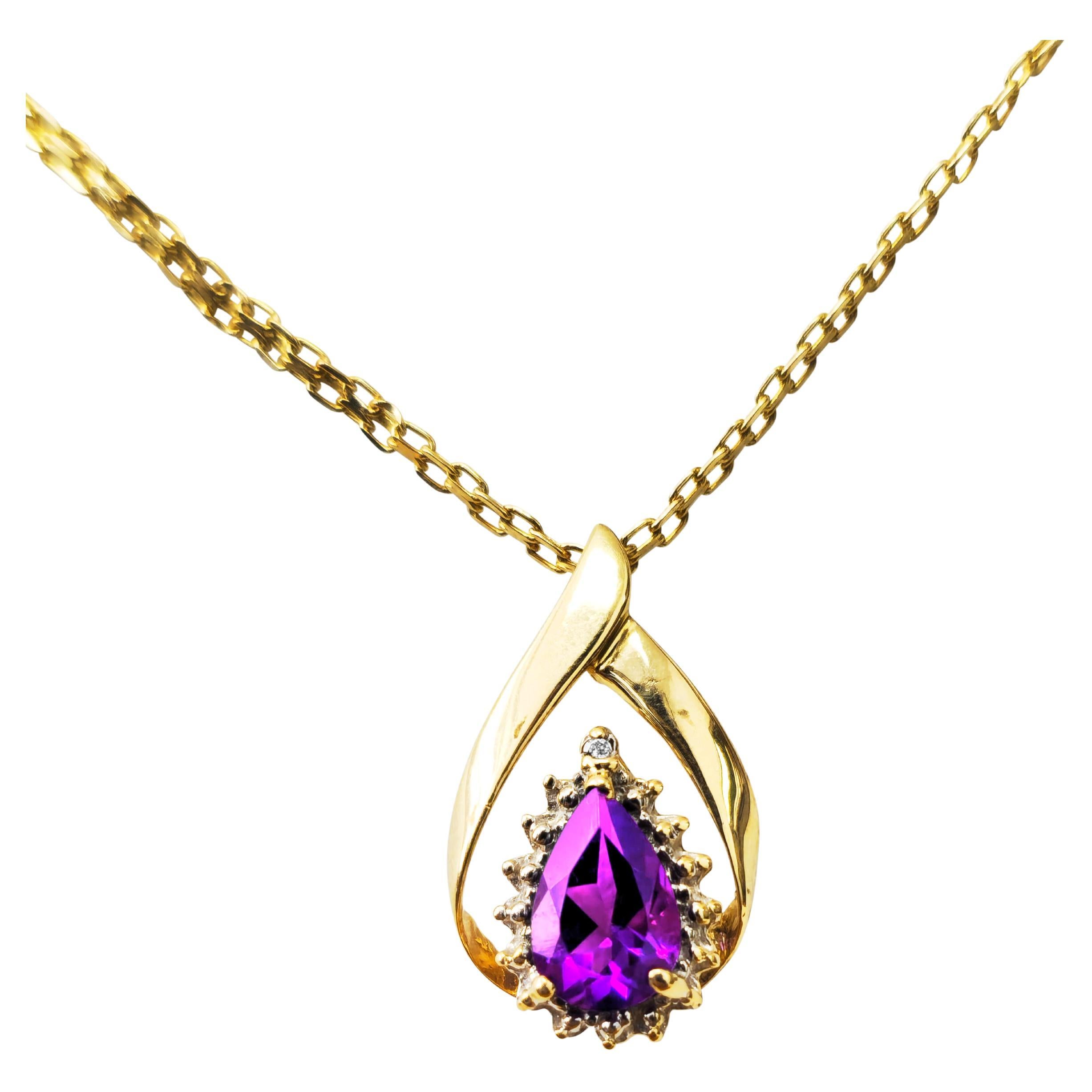 This pendant, weighing 2.1 grams, features a stunning 1.25-carat center stone accented by a total of 0.10 carats of diamonds with SI1 clarity and F color. Its dimensions are 0.85 x 0.50 inches, making it a captivating and elegant piece of jewelry