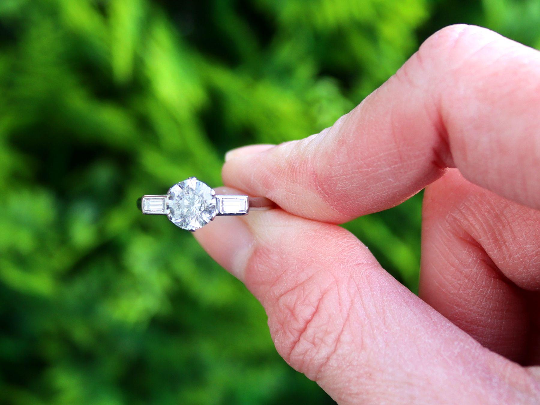 A stunning, fine and impressive vintage 1.28 carat (total) diamond solitaire ring in platinum; part of our antique engagement ring collections.

This stunning, fine and impressive vintage solitaire ring has been crafted in platinum.

The ring