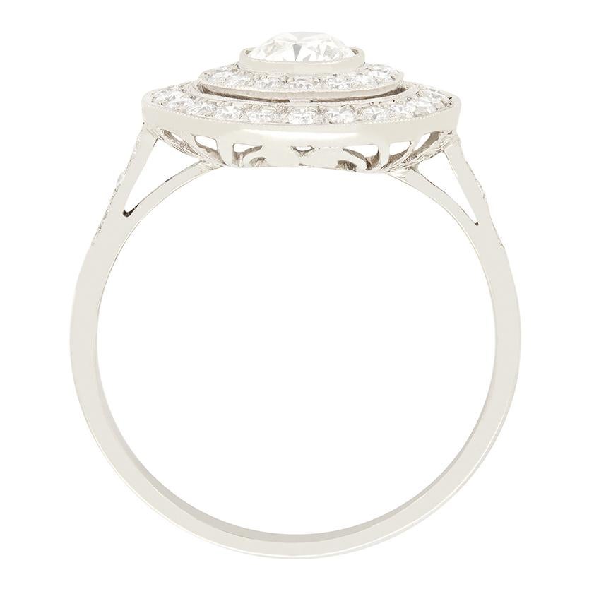 This gorgeous double halo ring boasts a total of 1.29 carat worth of diamonds. The central diamond itself is 0.65 carat with a further 0.64 carat surrounding. All the diamonds are round brilliant cut, with the central stone graded I in colour and