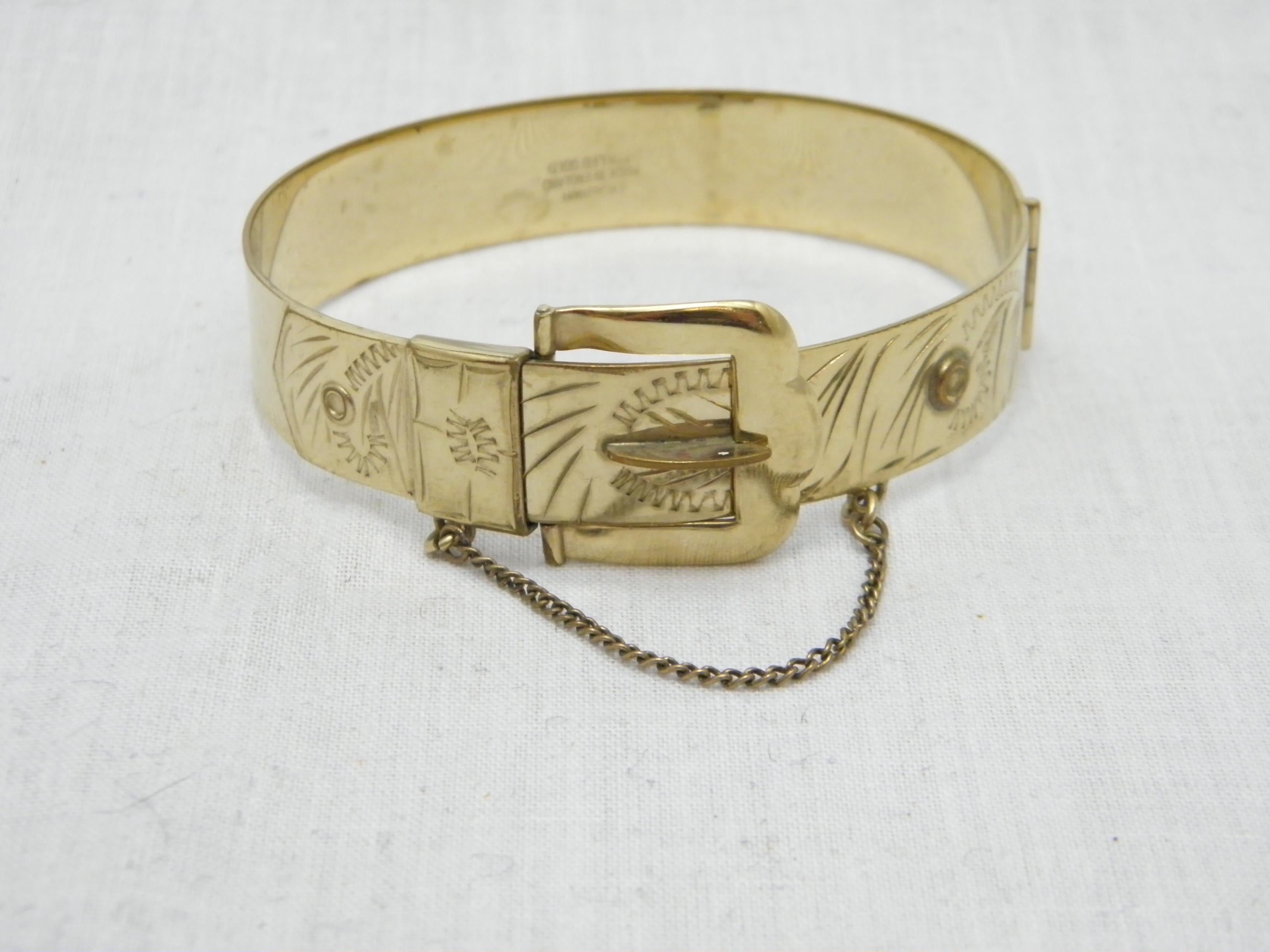 If you have landed on this page then you have an eye for beauty.

12CT GOLD ROLLED BUCKLE CUFF BANGLE BRACELET

DETAILS
Material: Thick 12ct Rolled Gold (see details below)
Style: Hinged Cuff with Hand Engraved Leaf detail and working buckle