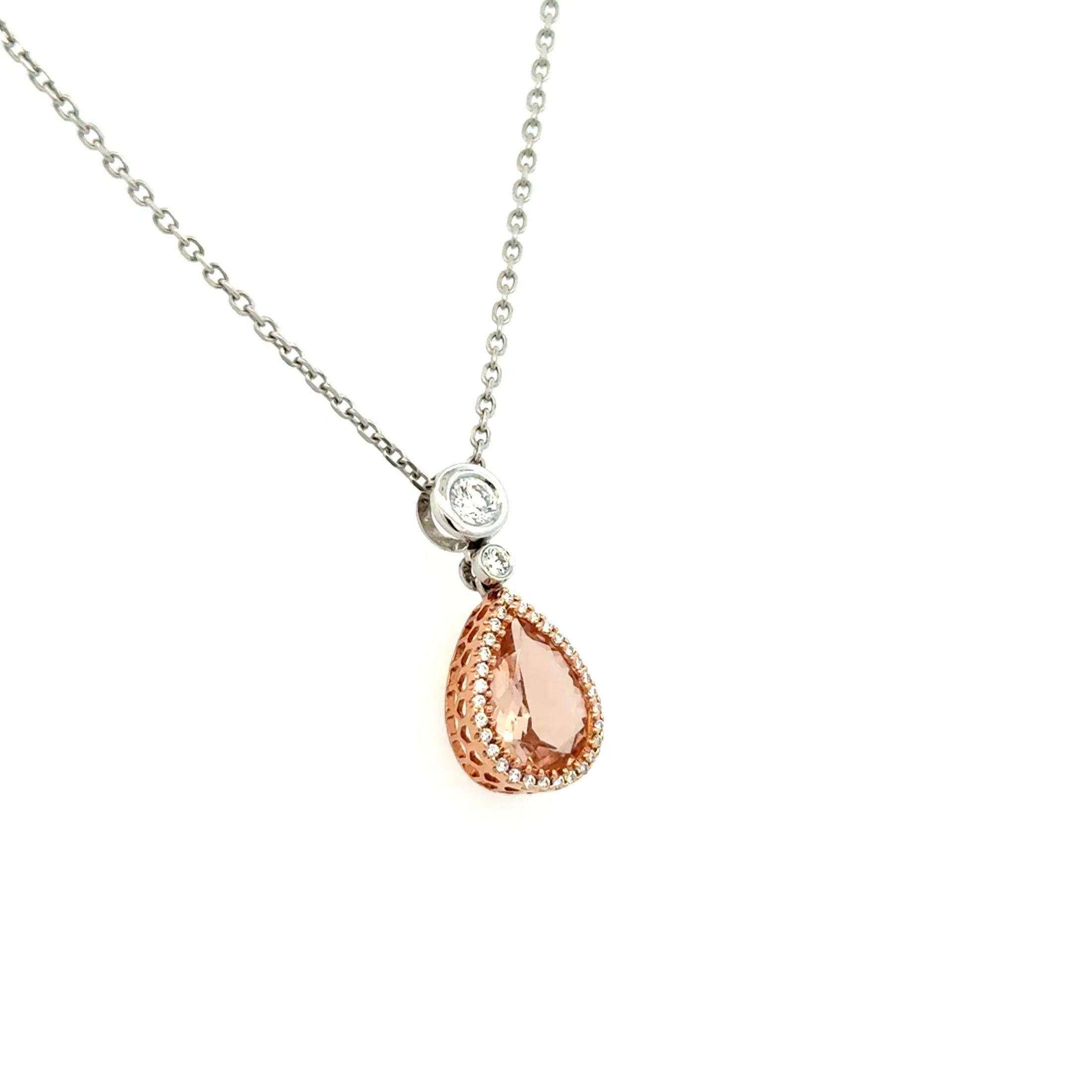 Simply Beautiful! Finely detailed Vintage Morganite and Diamond Gold Drop Pendant Necklace. Featuring a securely Hand set 1.3 Carat Pear Morganite. Enhanced with Round Brilliant Cut Diamonds, weighing approx. 0.45tcw. Hand crafted 14K 2-tone Gold